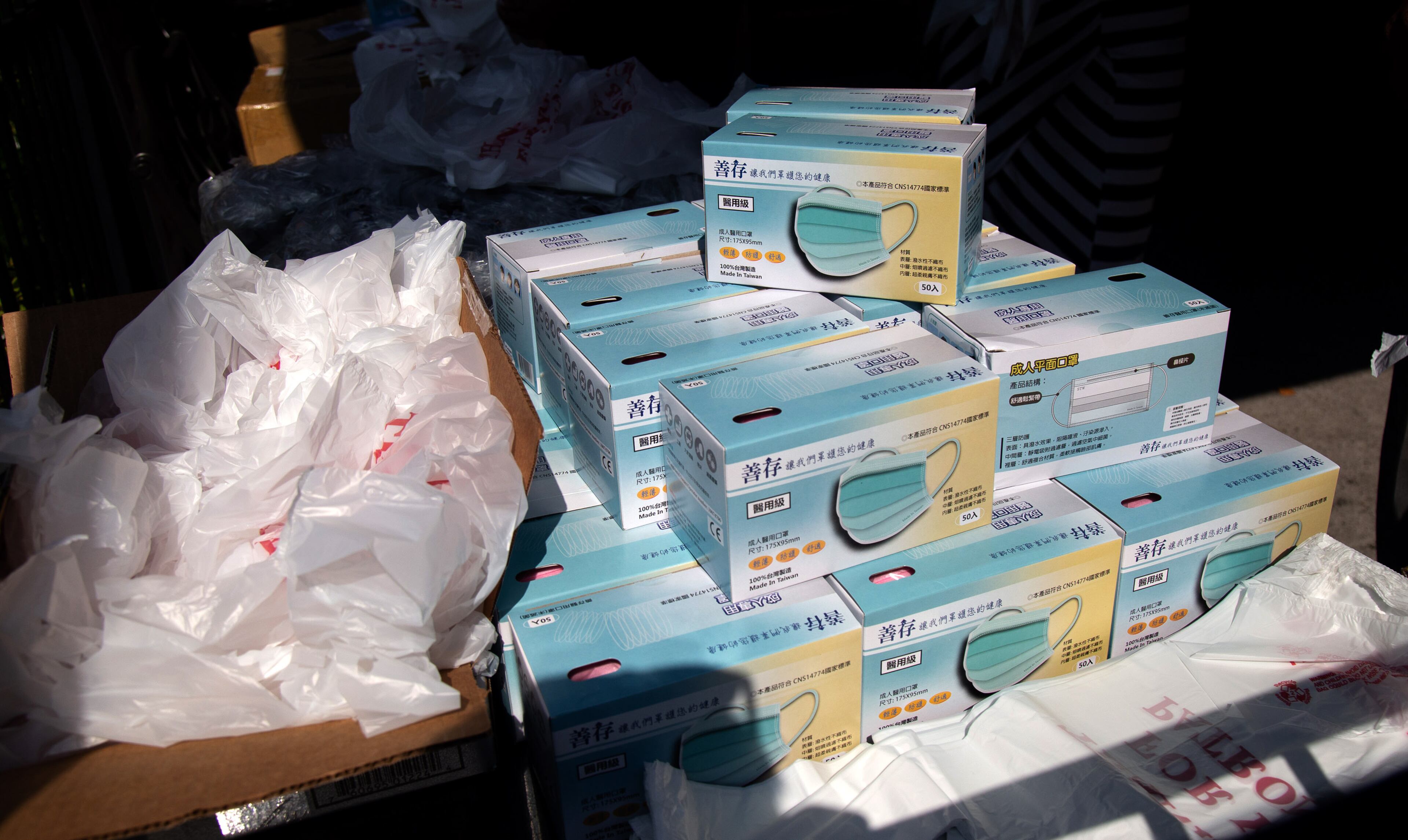 Some of the 8,000 masks and 300 face goggles are stacked up and ready to hand out at the Sandtown Pub August 6, 2020. STEVE SCHAEFER FOR THE ATLANTA JOURNAL-CONSTITUTION