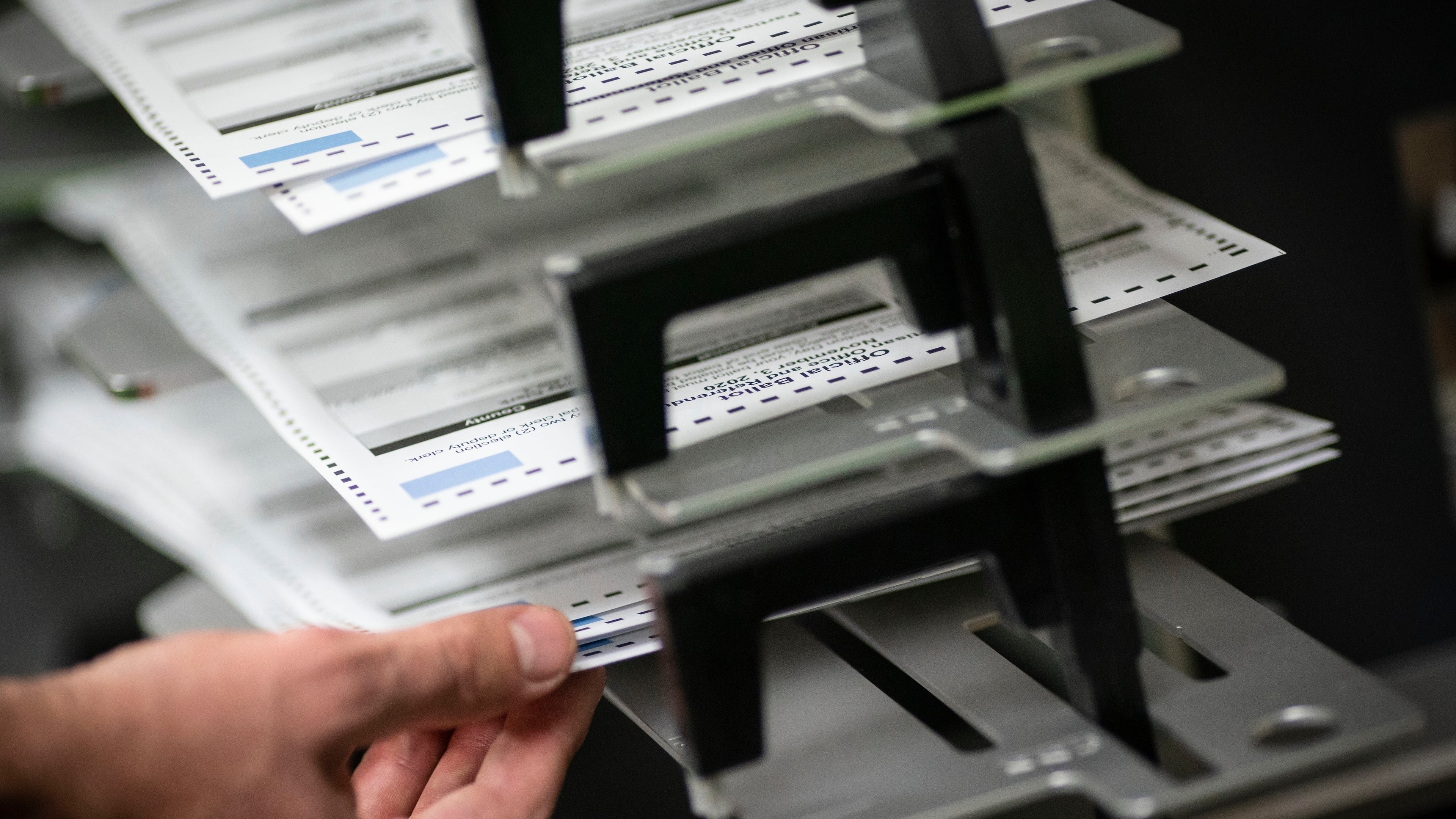 FILE - Poll workers sort ballots at the Kenosha Municipal Building on Election Day, Nov. 3, 2020, in Kenosha, Wis. (AP Photo/Wong Maye-E, File)
