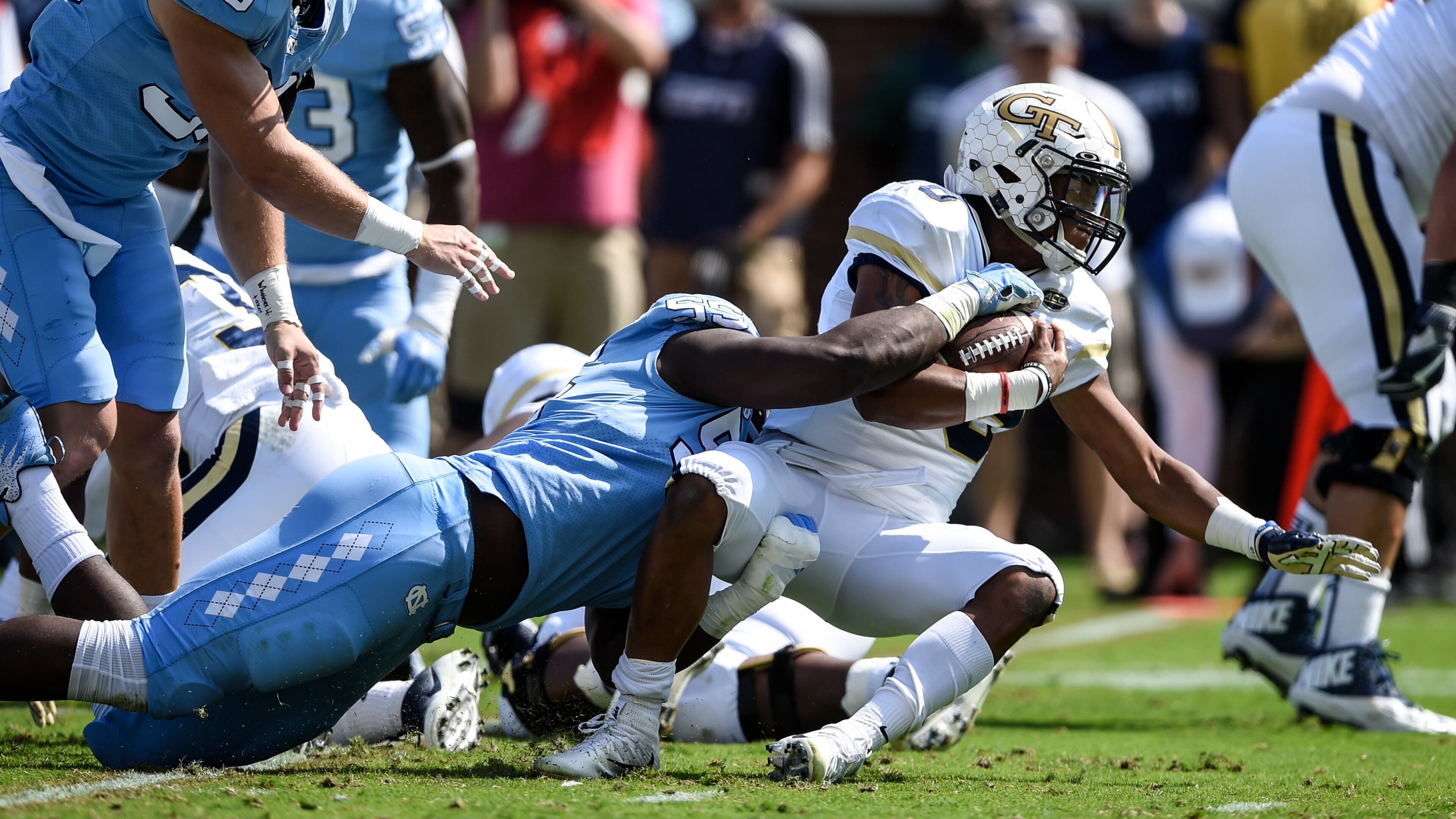 North Carolina defensive lineman Jason Strowbridge (55) tackles Georgia Tech quarterback TaQuon Marshall (16) during the first half of an NCAA college football game, Saturday, Sept. 30, 2017, in Atlanta. (AP Photo/Jon Barash)