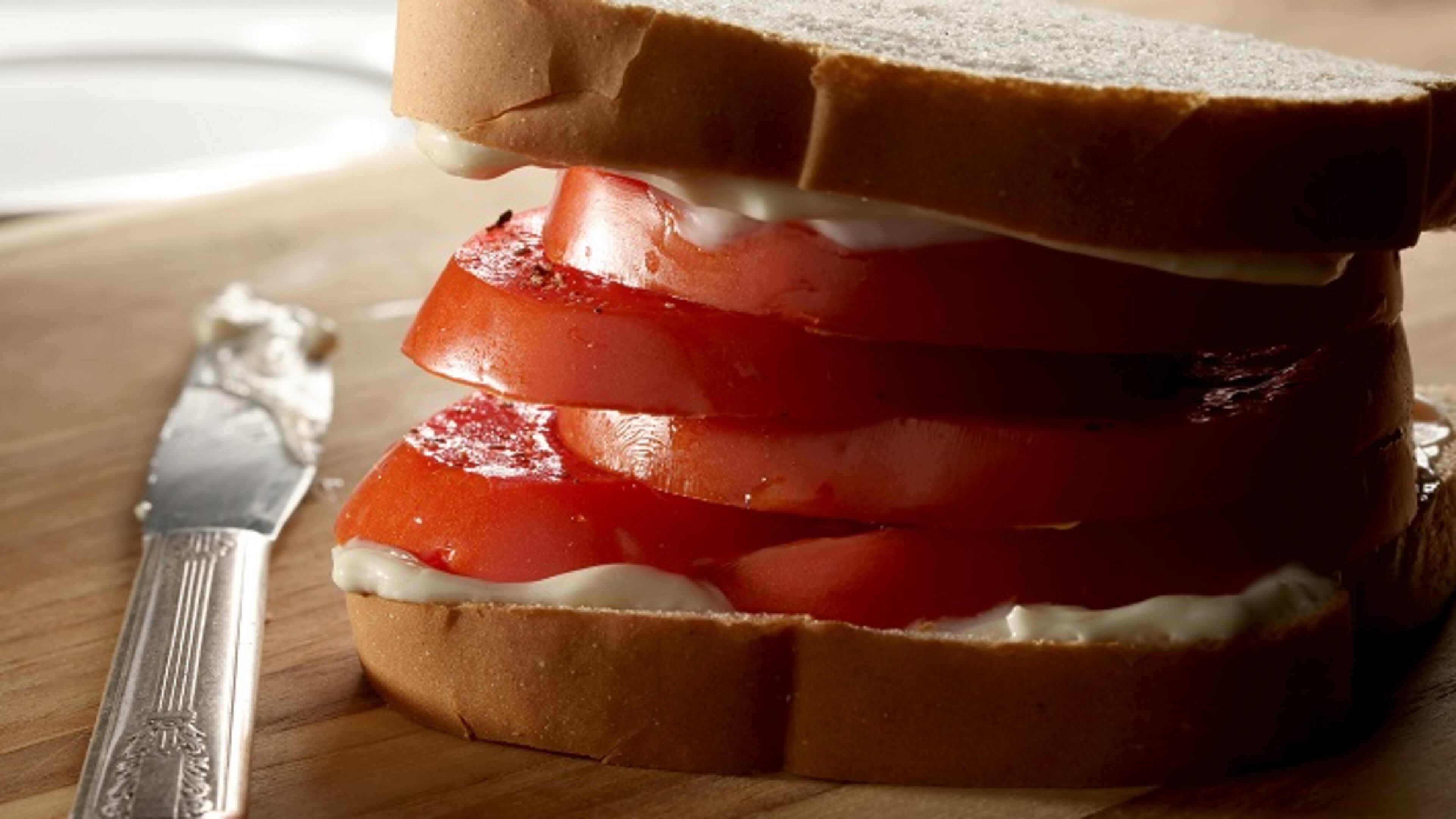 Southern tomato sandwich is the classic with just tomatoes and mayo stacked high on plain white bread. (Michael Tercha/Chicago Tribune/TNS)