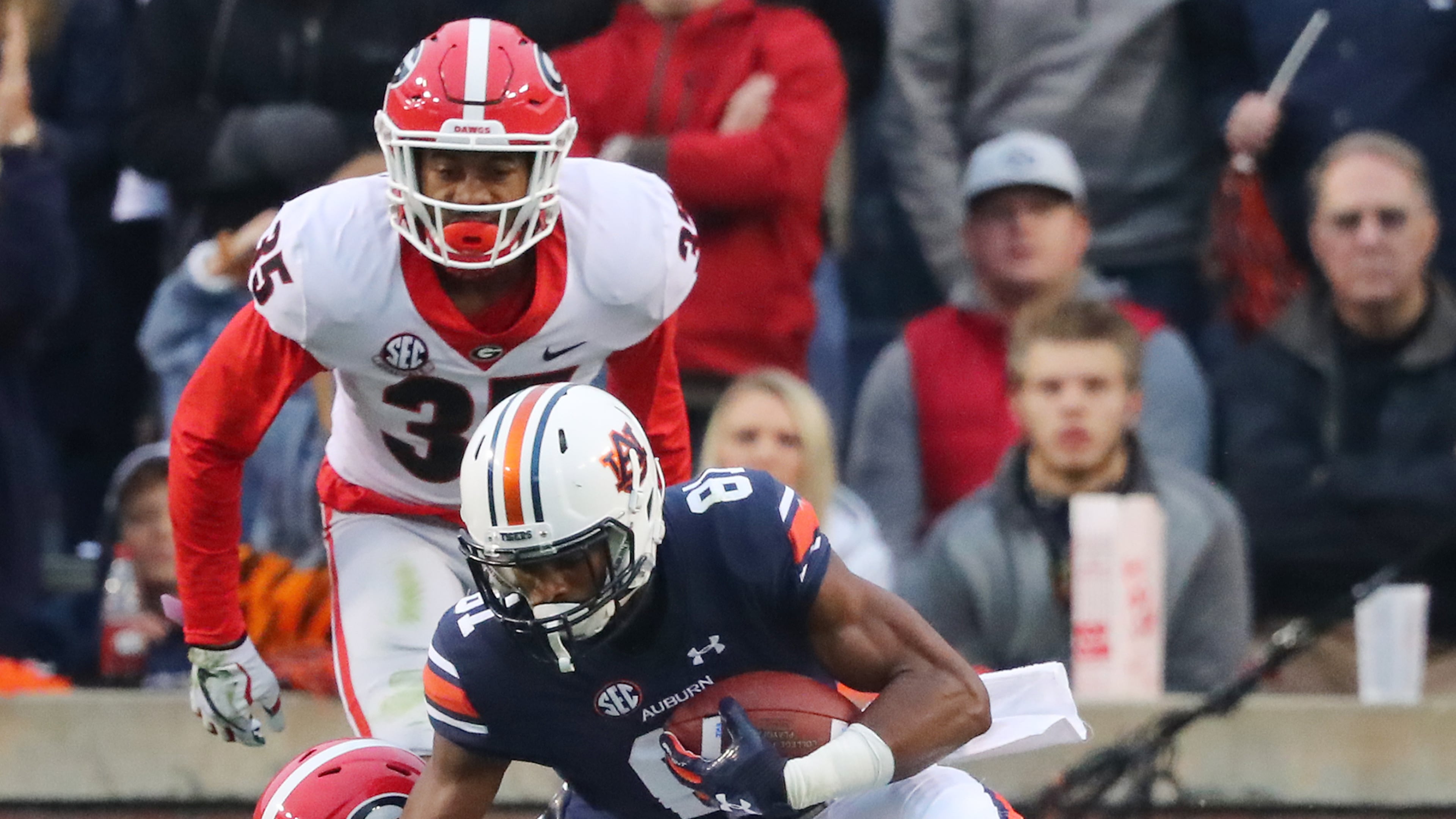 November 11, 2017 Auburn : Auburn wide receiver Darius Slayton makes a touchdown catch in front of Georgia defenders Malkom Parrish and Aaron Davis to take a 16-7 lead during the second quarter in a NCAA college football game at Jordan-Hare Stadium on Saturday, November 11, 2017, in Auburn. Curtis Compton/ccompton@ajc.com