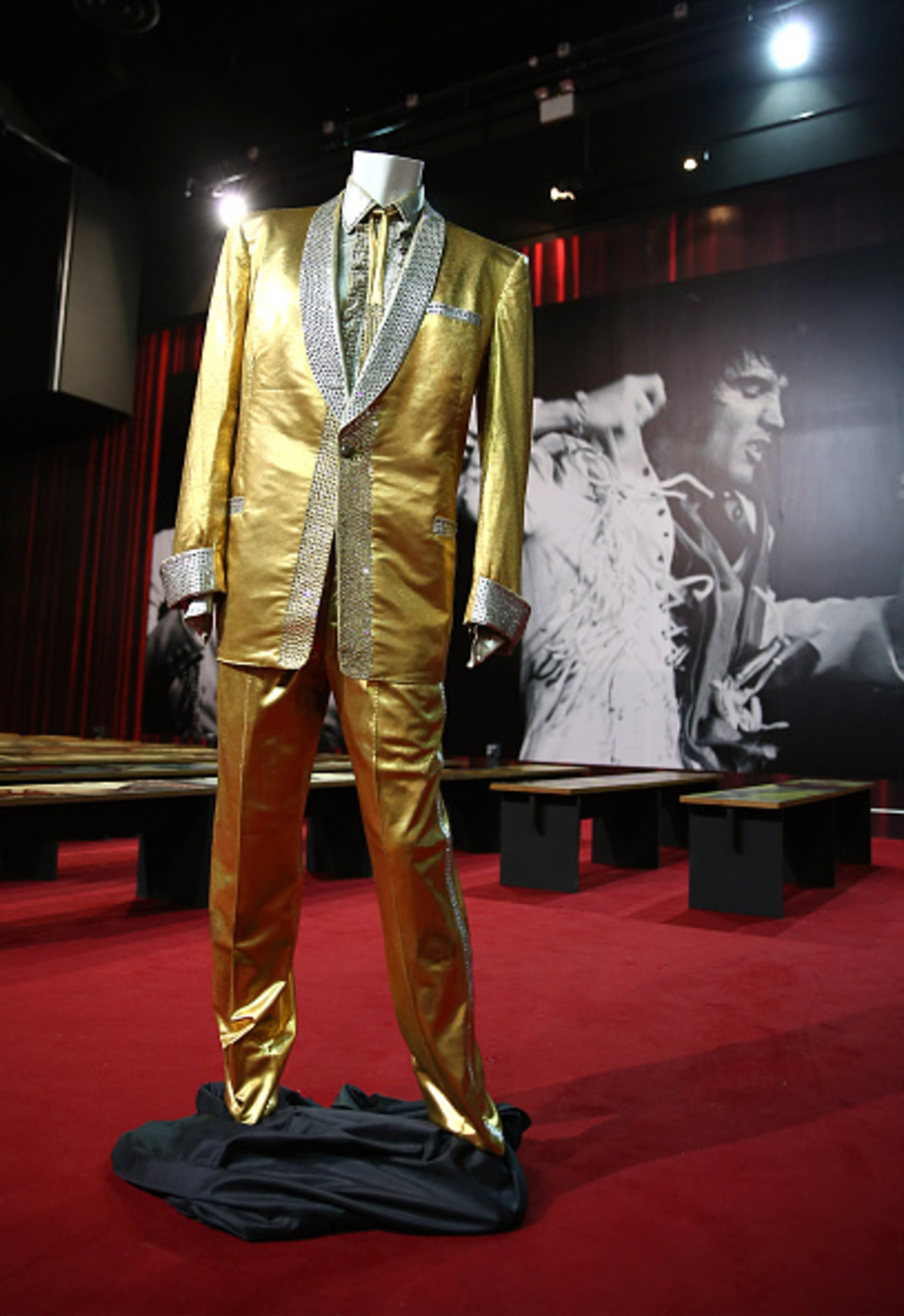 LONDON, ENGLAND - APRIL 09: The iconic gold suit worn by Elvis Presley on the cover of his album '50,000,000 Fans Can't Be Wrong' on display at The O2 Arena on April 9, 2015 in London, England. The suit will form part of the Elvis at The O2: The Exhibition of His Life from Sunday 12th April for a limited time of two months before being returned to Graceland. (Photo by Tim P. Whitby/Getty Images)