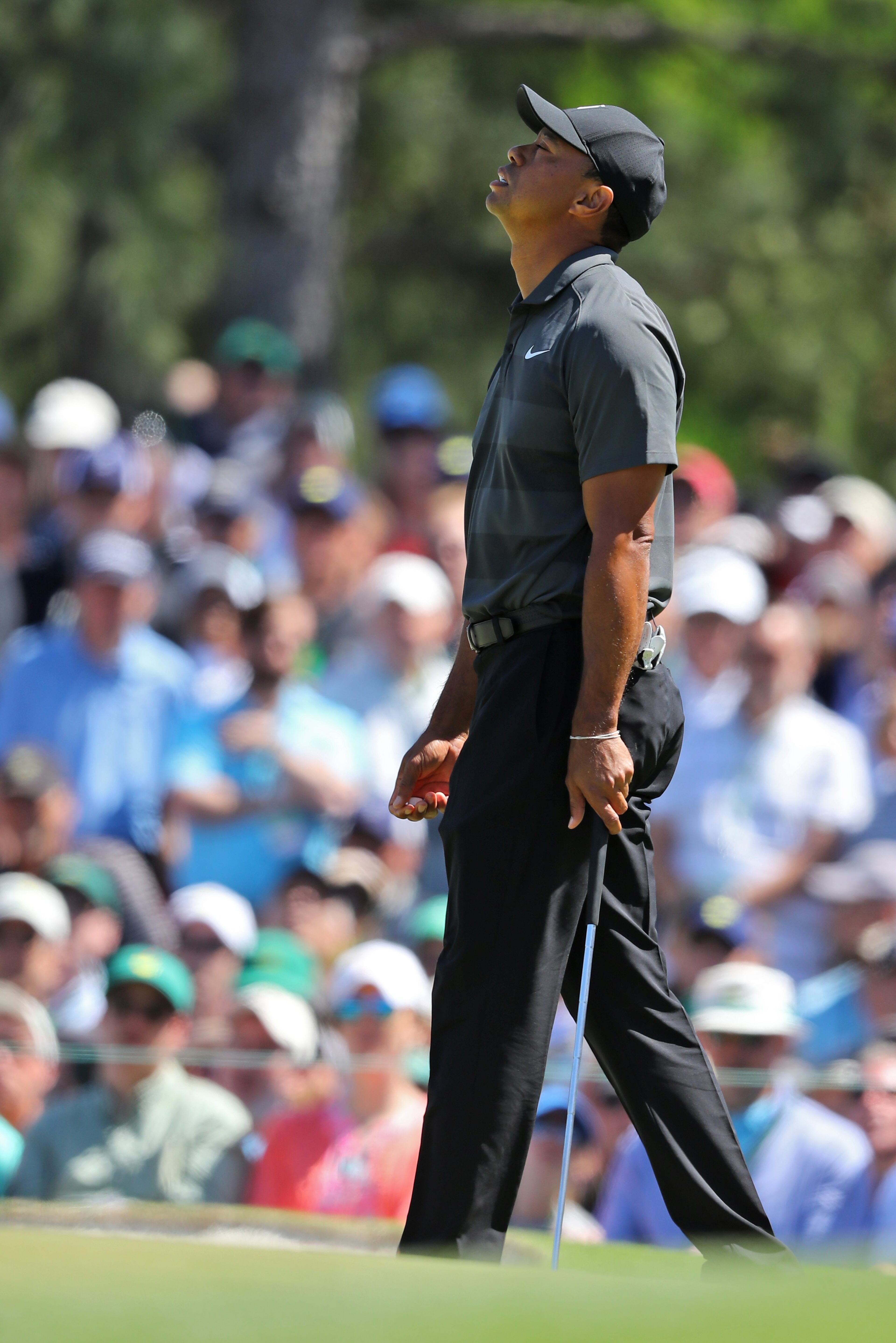 4/5/18 - Augusta - Tiger Woods reacts to missing his birdie putt on the seventh green during the first round of the Masters at Augusta National Golf Club on Thursday, April 5, 2018, in Augusta. Curtis Compton/ccompton@ajc.com