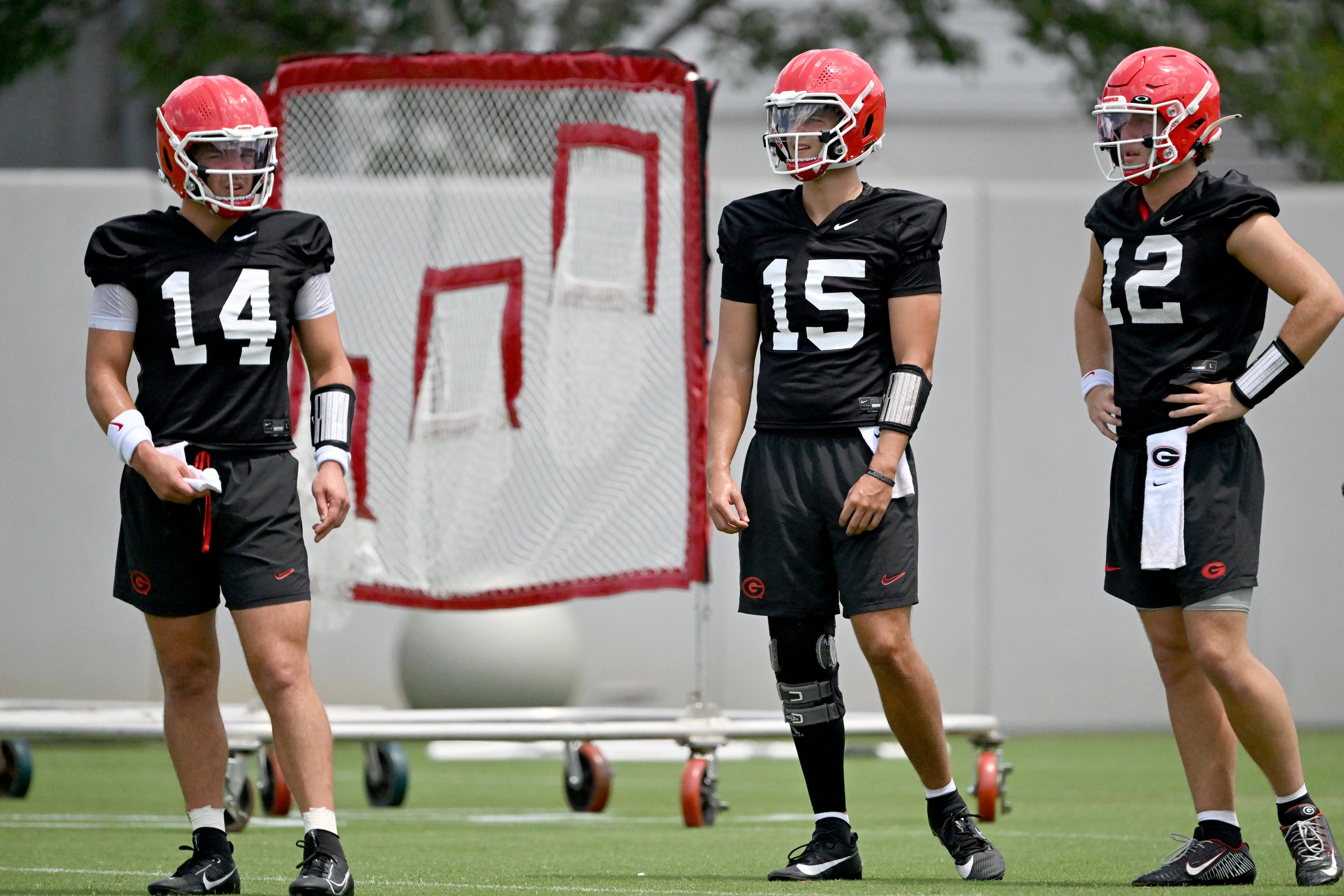 Georgia quarterbacks Gunner Stockton (from left), Ryan Montgomery and Ryan Puglisi participate in practice on Thursday, July 31, 2025, in Athens. Kirby Smart made it clear he wouldn’t announce a starting quarterback before Georgia opens the season. (Hyosub Shin/AJC)
