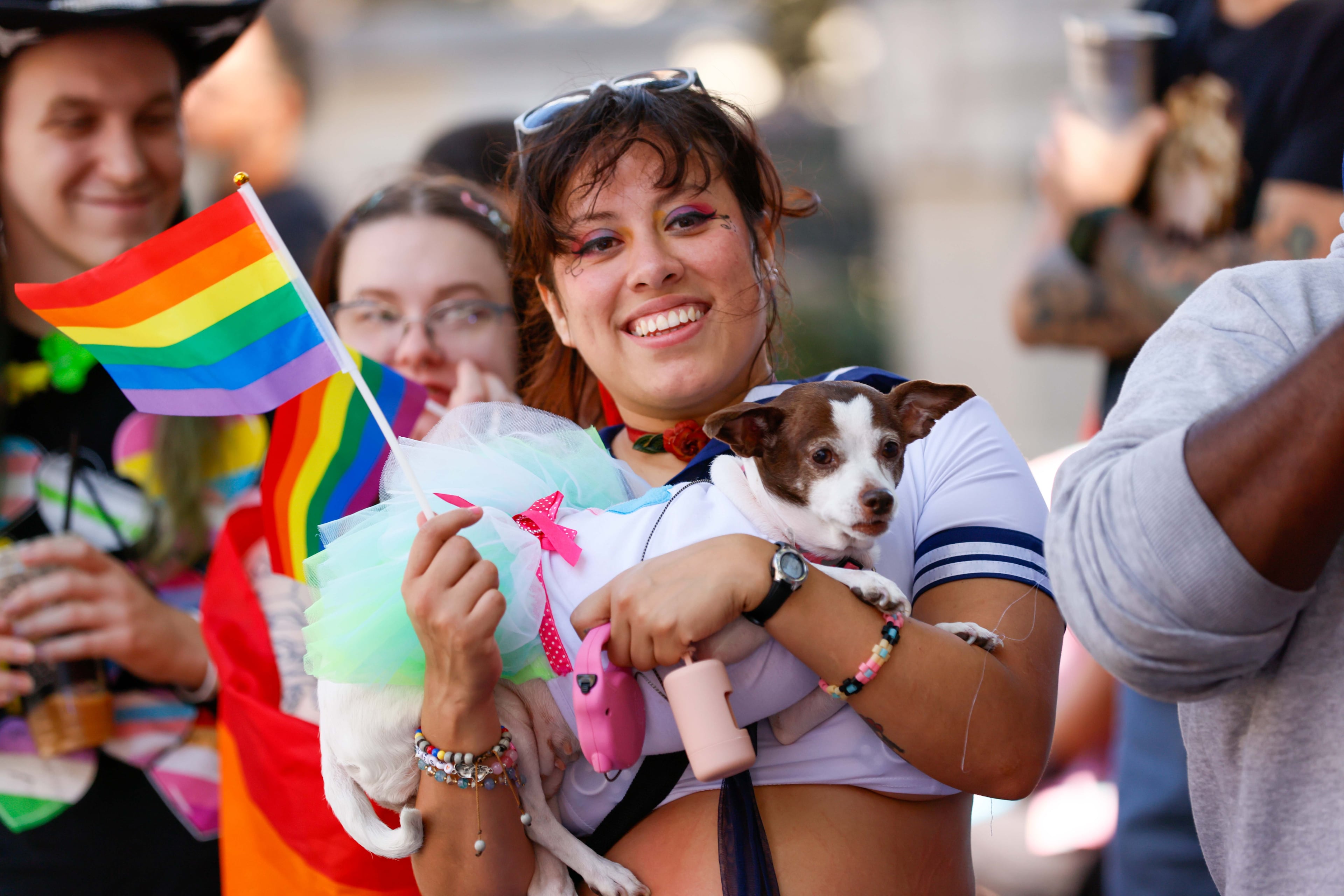Nuddle Piñon from Atlanta holds her dog “Bonita.” during the annual Pride Parade, which begins on Peachtree Street and ends in Piedmont Park on Sunday, Oct. 13, 2024.
(Miguel Martinez / AJC)