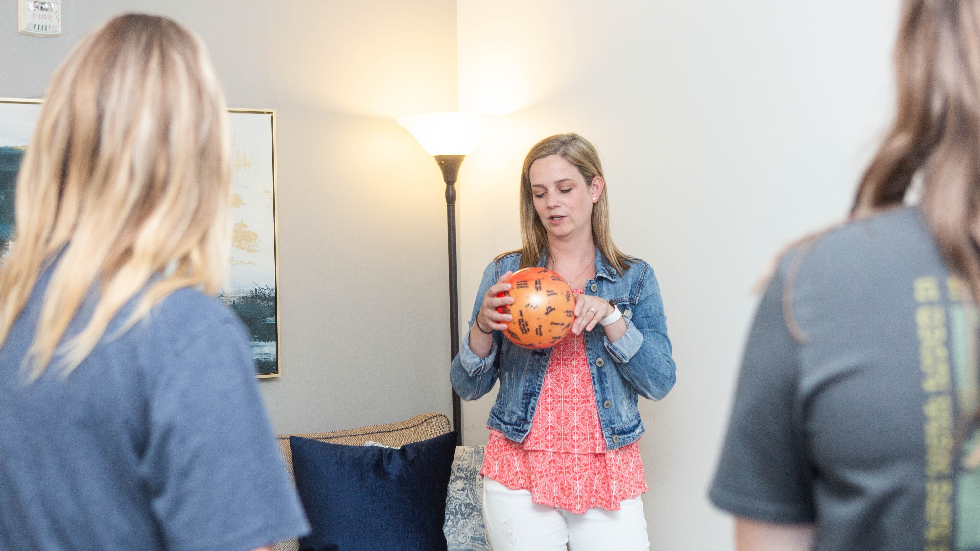 During the first week, Jessica Alexander starts with an ice-breaker activity using a ball that has questions written on it. The ball is tossed around generating answers such as introducing themselves, why they are there, what they hope to learn, etc.