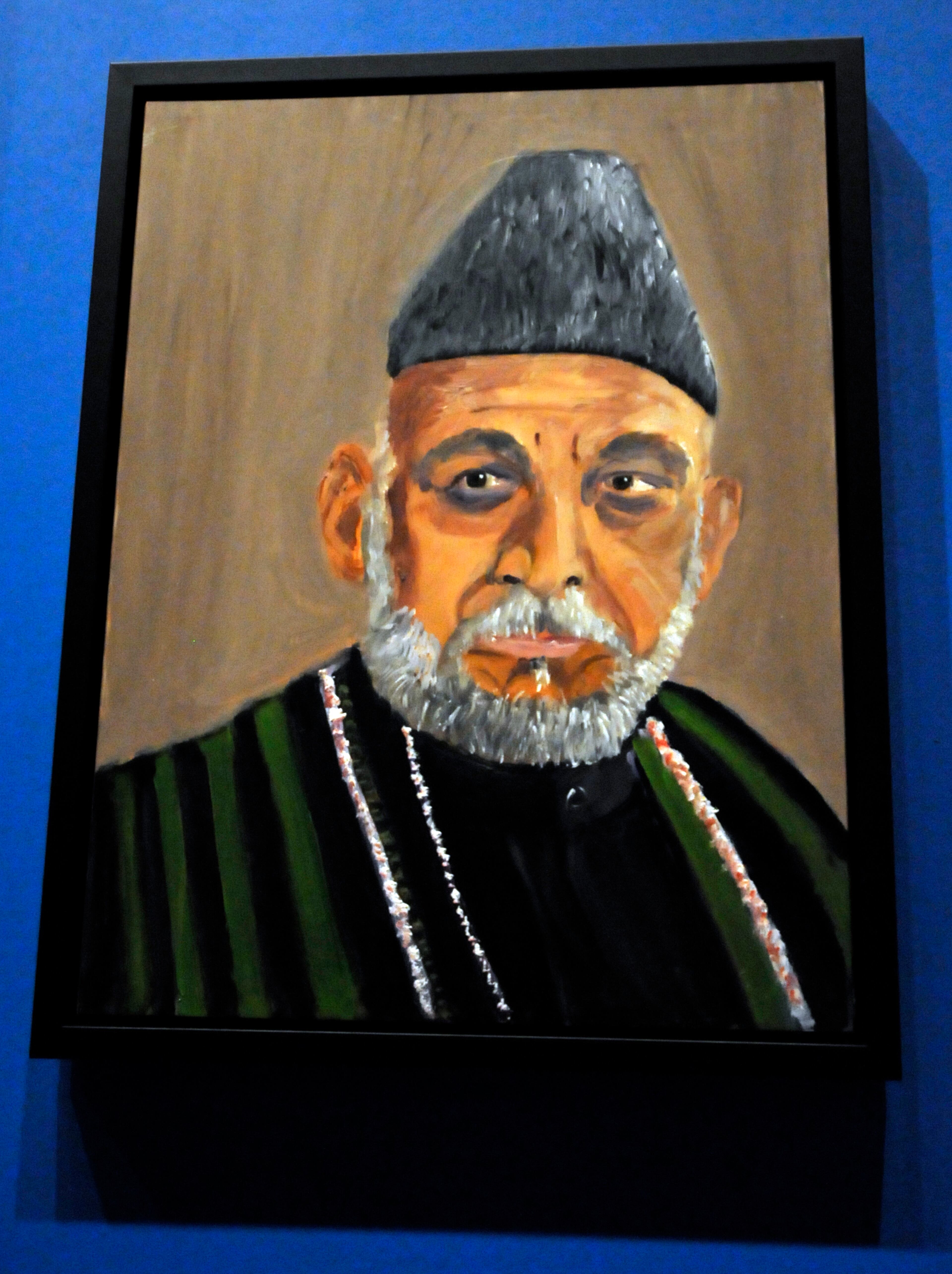 A portrait of Afghan President Hamid Karzai which is part of the exhibit "The Art of Leadership: A President's Diplomacy," is on display at the George W. Bush Presidential Library and Museum in Dallas, Friday, April 4, 2014. The exhibit of world leader portraits painted by former President George W. Bush opens Saturday and runs through June 3. (AP Photo/Benny Snyder)
