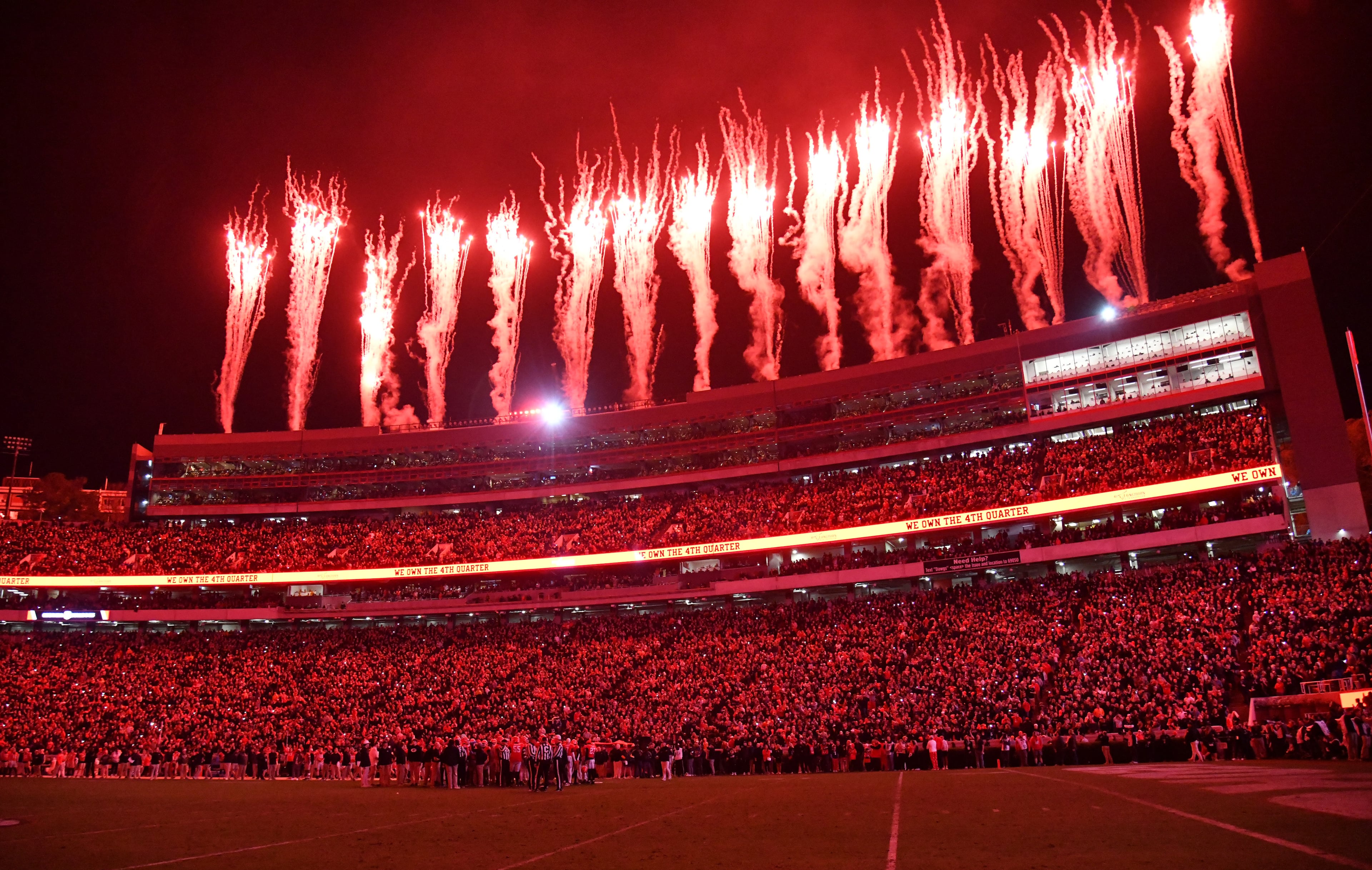 Georgia fans light up the stadium at the start of the fourth quarter in an NCAA football game against Tennessee at Sanford Stadium, Saturday, November 16, 2024, in Athens. Georgia won 31-17 over Tennessee. (Hyosub Shin / AJC)