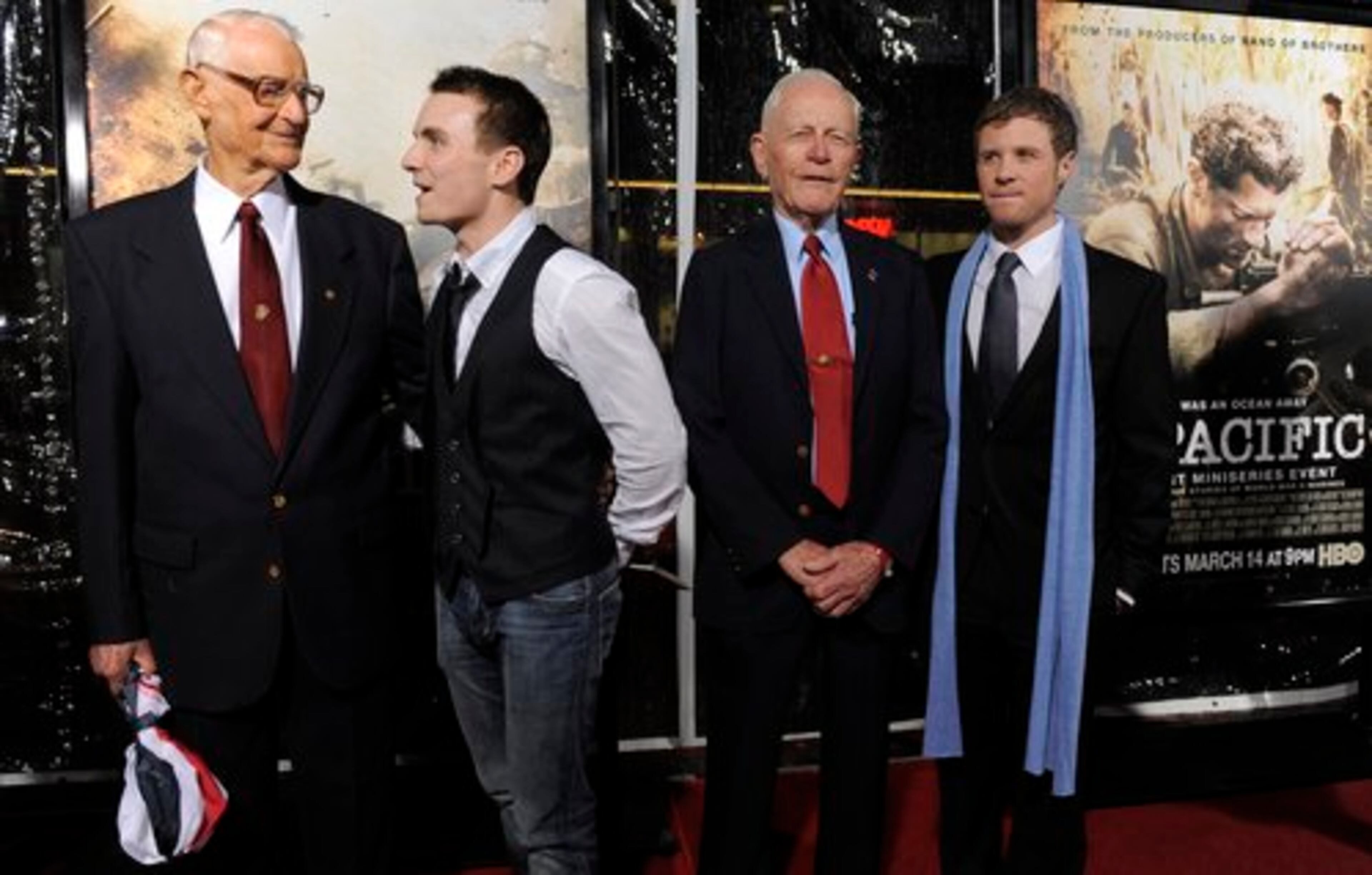 Actors Martin McCann, second from left, and Ashton Holmes, far right, pose with the U.S. Marines they portrayed in "The Pacific. " At left is Marine Pfc. R.V. Burgin, played by McCann, and second from right is Marine Pfc. Dr. Sidney Phillips, played by Holmes.