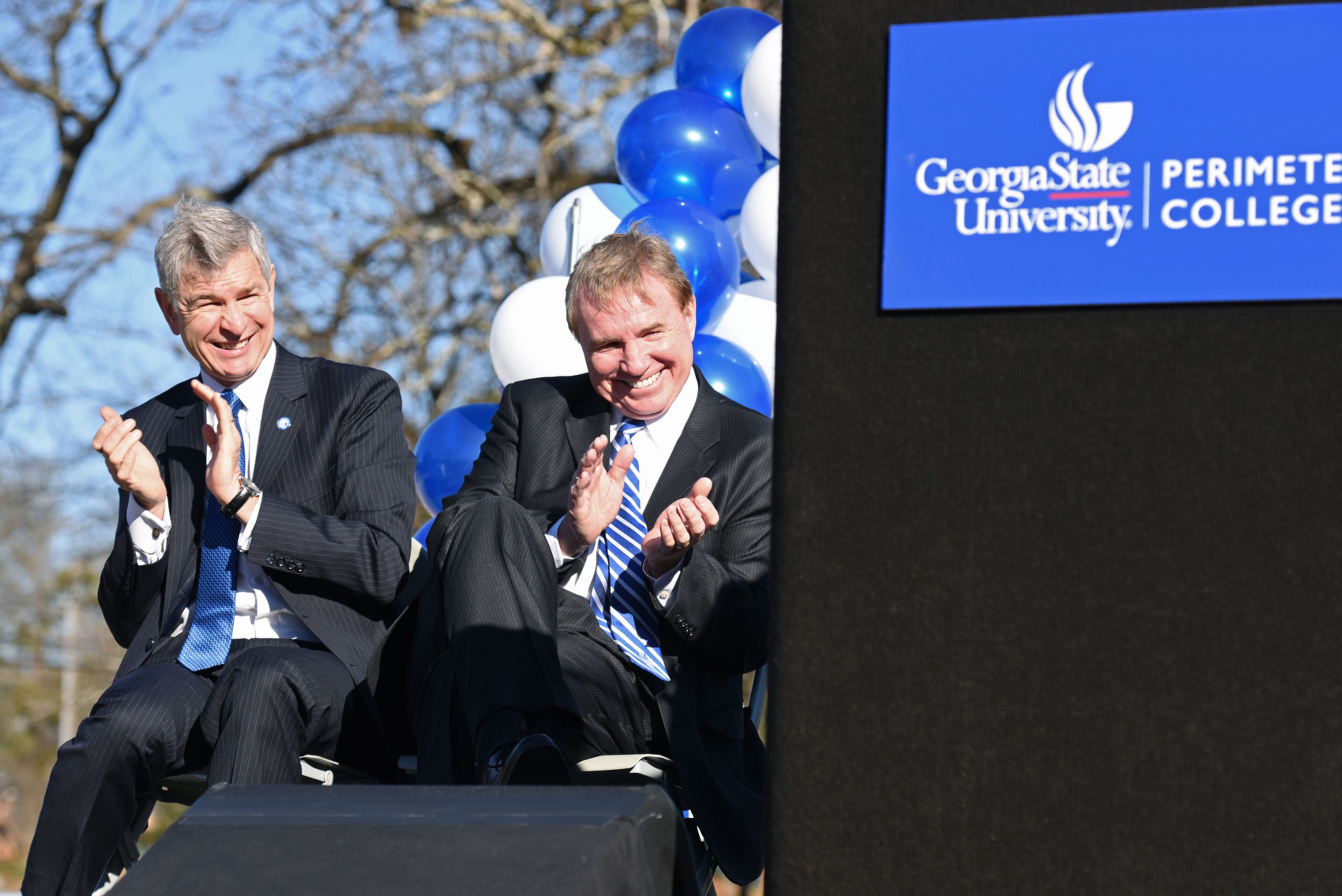 Mark Becker (left), President of Georgia State University, and Peter Lyons, Dean of Perimeter College, react during an unveiling ceremony at Georgia State University Clarkston Campus on Wednesday, January 13, 2016. 29.
