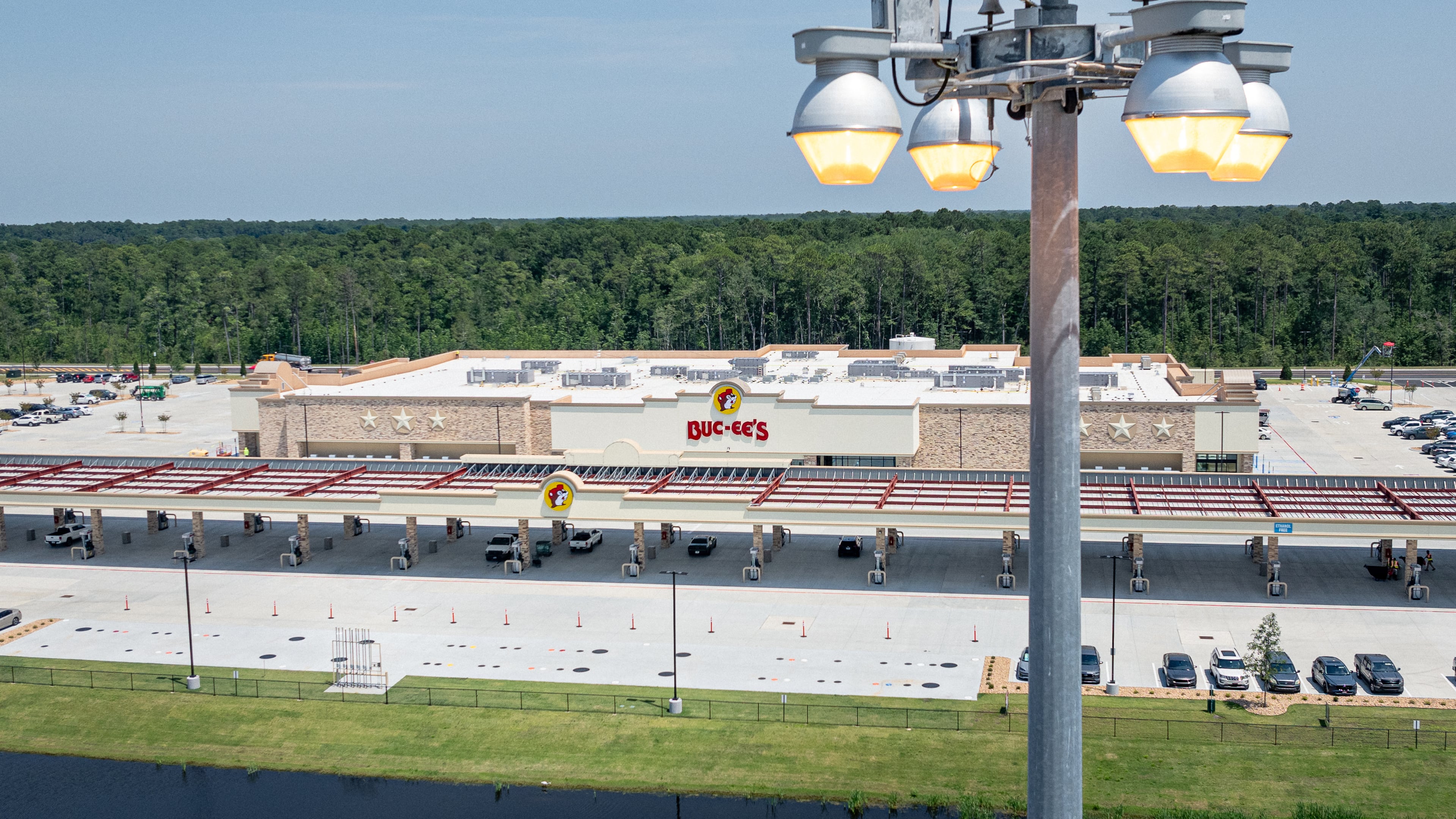 High-mast lights stand at I-95's Exit 42, the location of the new Buc-ee’s in Brunswick, on June 25, 2025. Buc-ee's has refused to comment on the lights, leading some critics to suspect the company is the reason for Glynn County's lack of action on the matter. (Justin Taylor/The Current GA/CatchLight Local)
