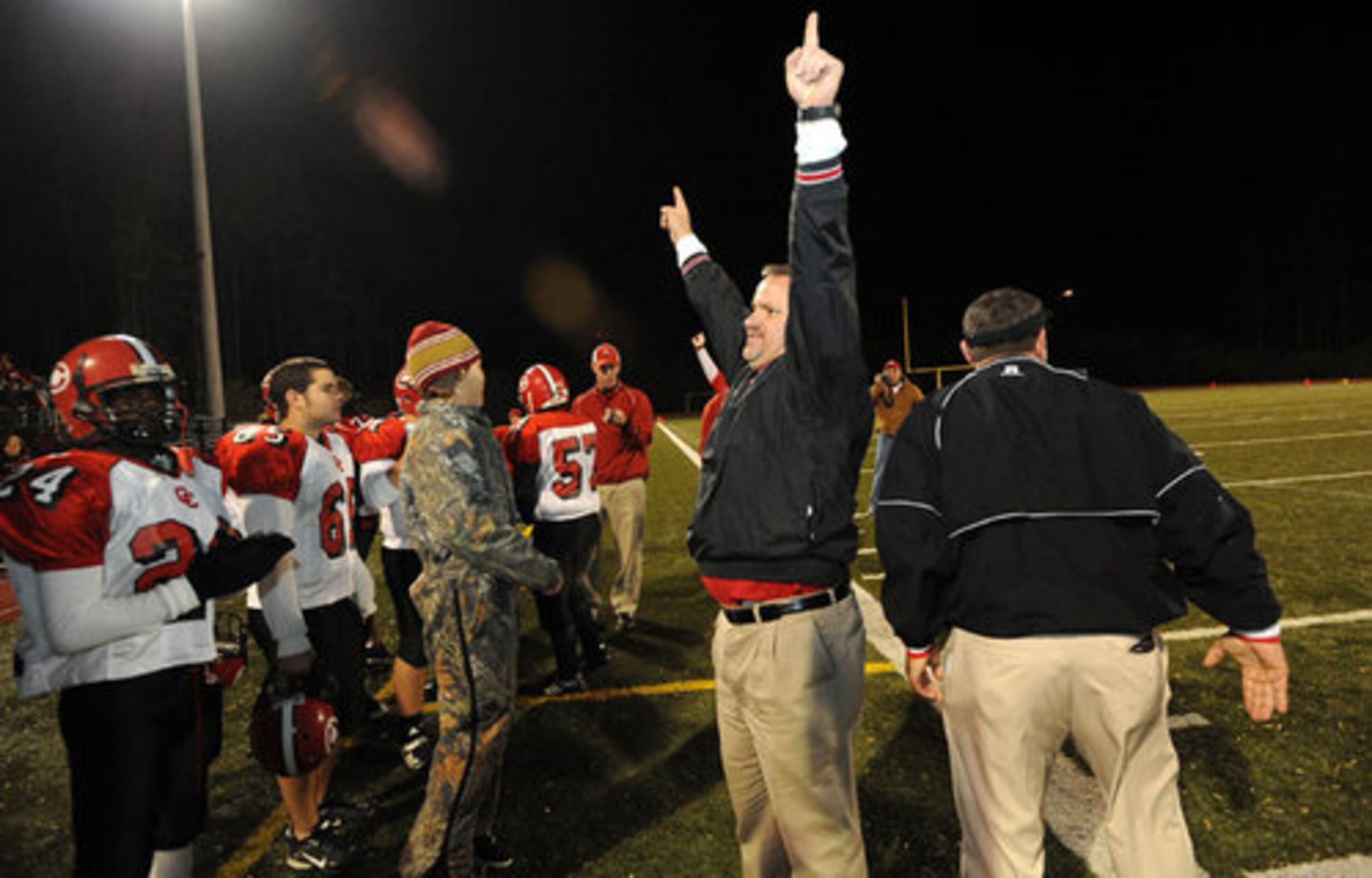 Clinch County Head Coach Jim Dickerson celebrates his team's 35-27 win over Holy Innocents'.