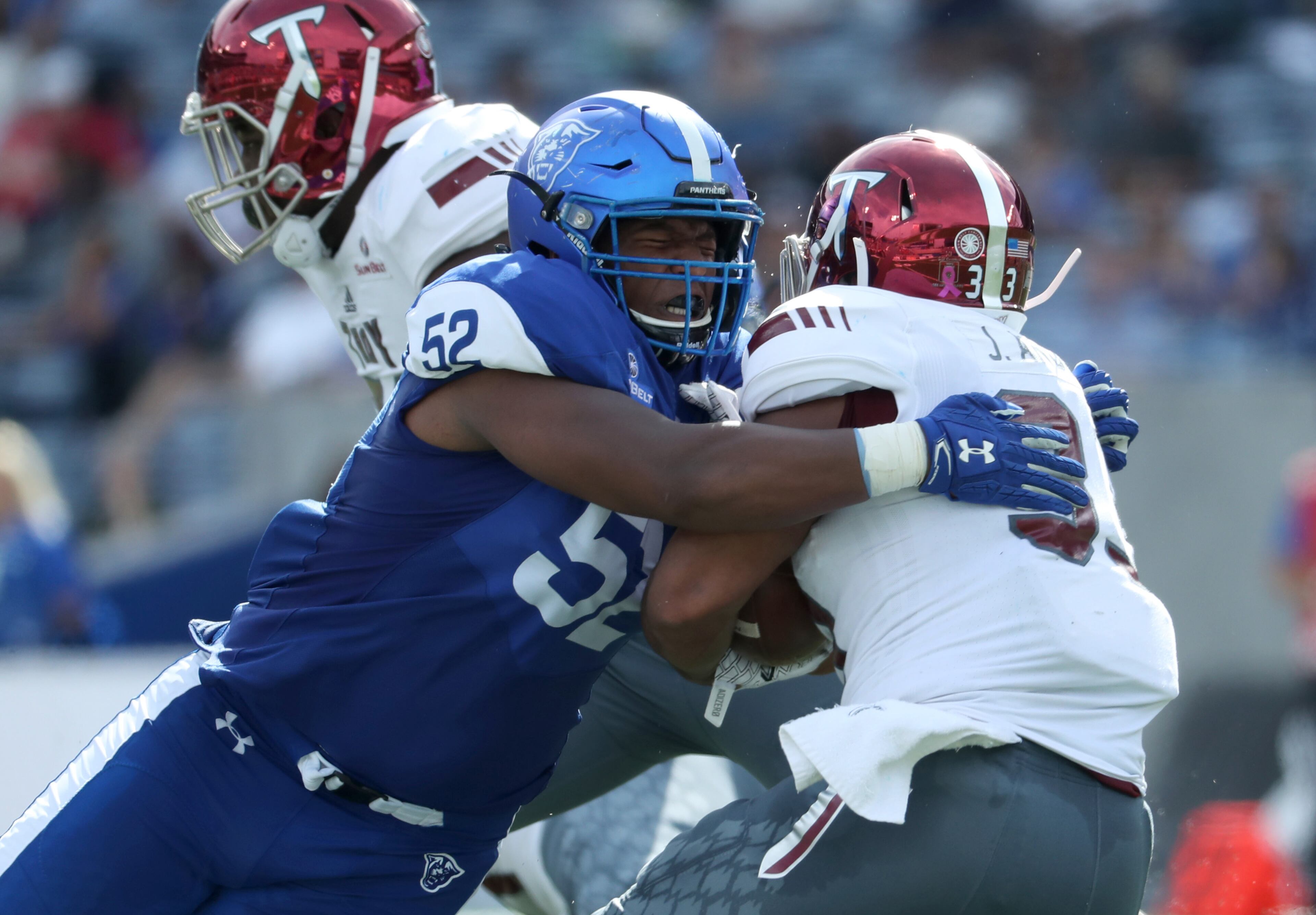 October 21, 2017 - Atlanta, Ga: Georgia State Panthers defensive lineman Dontae Wilson (52) tackles Troy Trojans running back Josh Anderson (33) for a short gain in the second quarter of their game at GSU Stadium Saturday, October 21, 2017, in Atlanta.. PHOTO / JASON GETZ