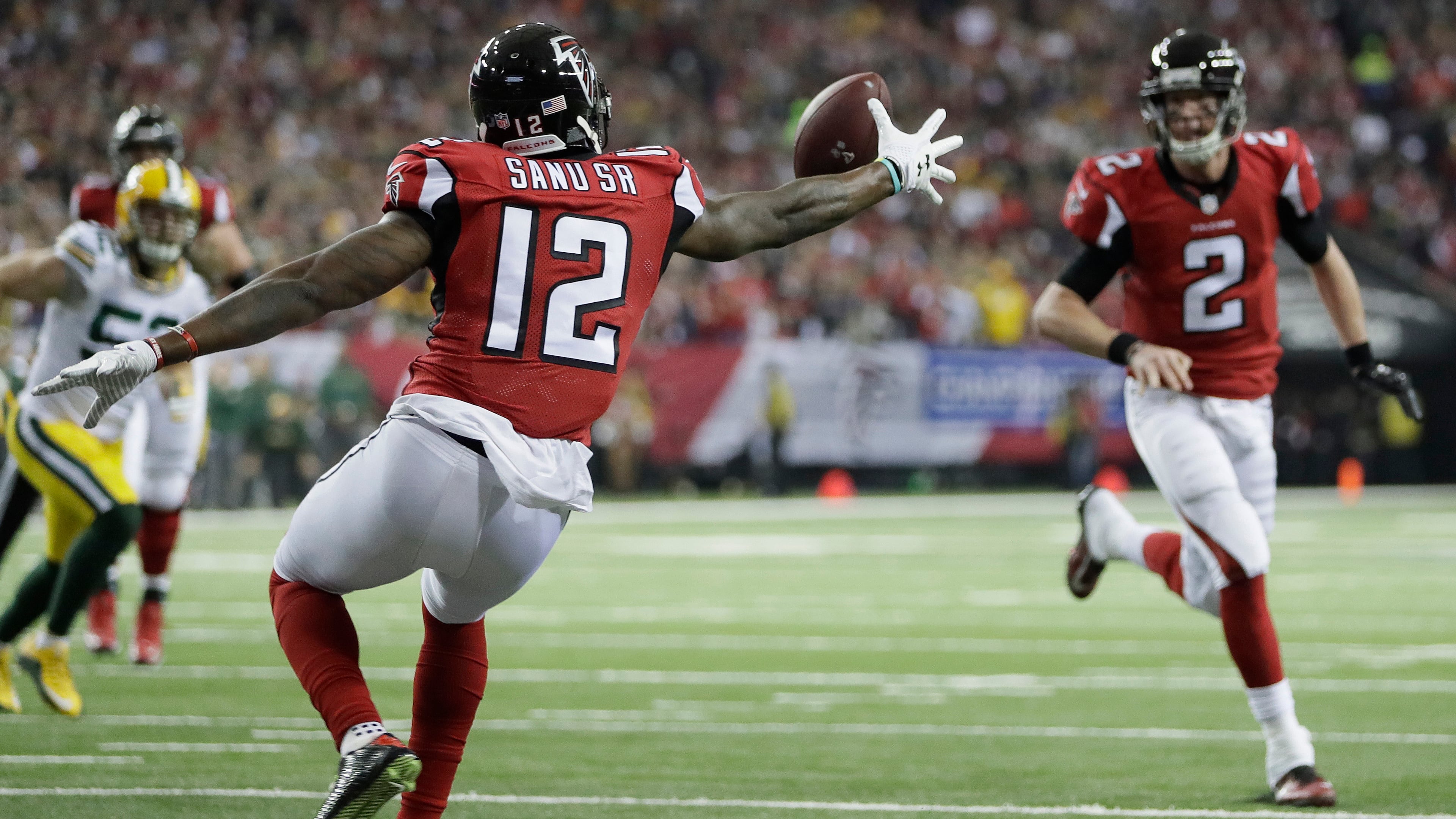 Atlanta Falcons' Mohamed Sanu catches a touchdown pass during the first half of the NFL football NFC championship game against the Green Bay Packers Sunday, Jan. 22, 2017, in Atlanta. (AP Photo/Mark Humphrey)