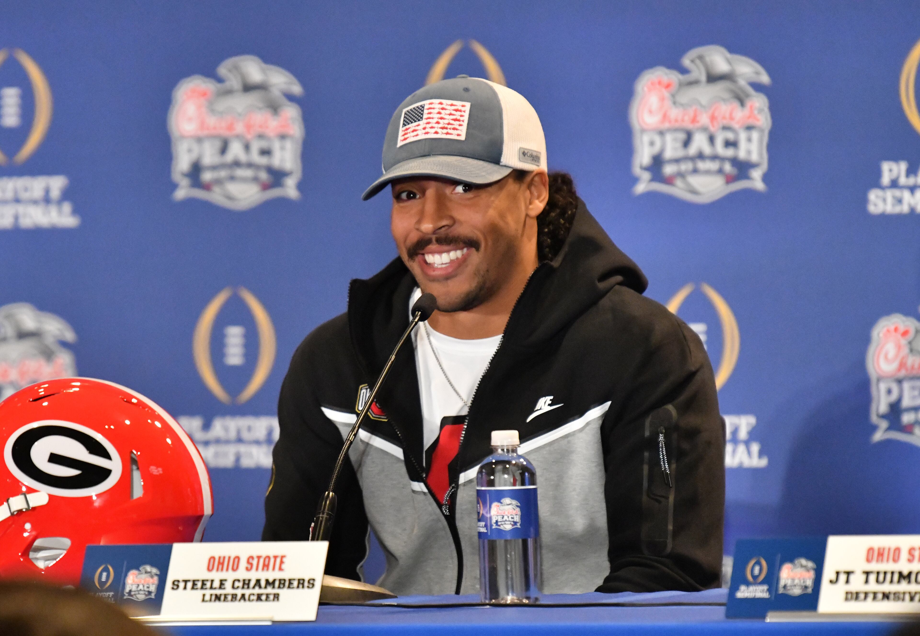 Linebacker Steele Chambers smiles during Ohio State's press conference ahead of the Chick-fil-A Peach Bowl at The Westin Peachtree Plaza in Atlanta on Wednesday, Dec. 28, 2022. Chambers graduated from Blessed Trinity High School in Roswell. (Hyosub Shin / Hyosub.Shin@ajc.com)