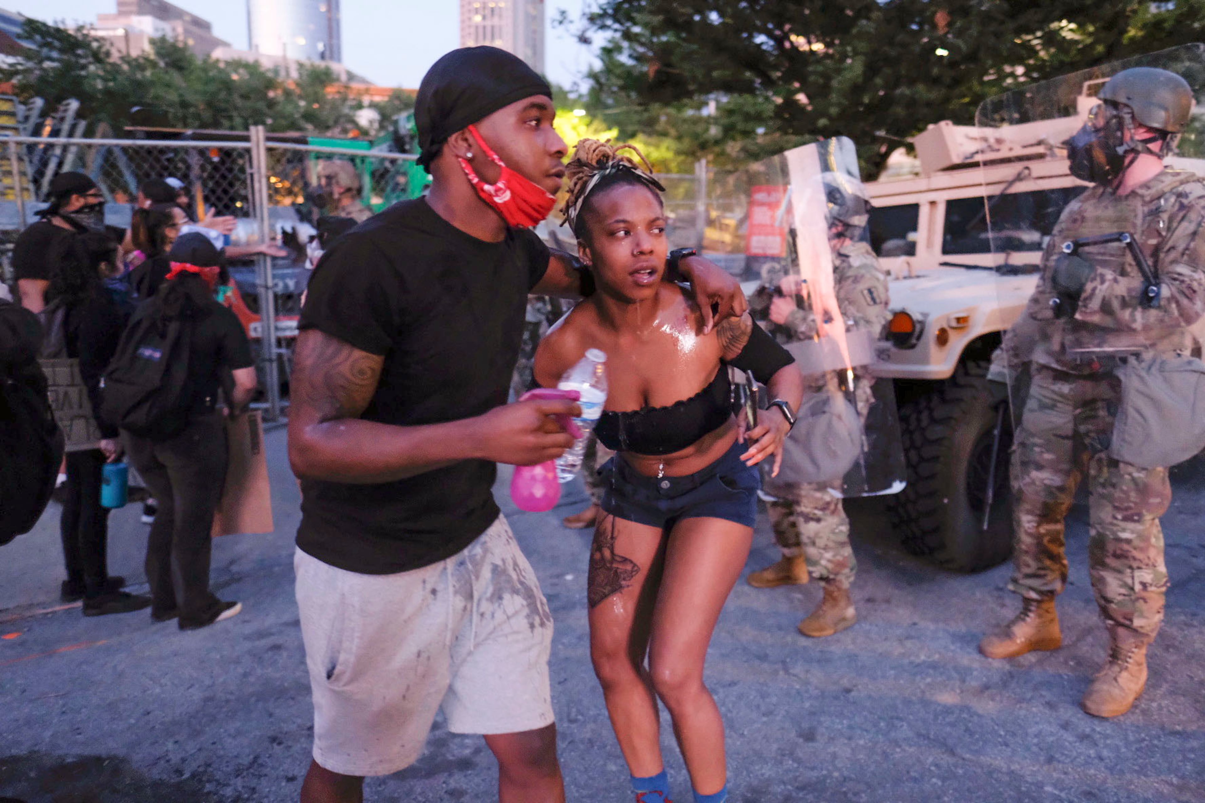 June 2, 2020 - Atlanta - Protestors dodge tear gas and police after the 9pm curfew in downtown Atlanta as protests continued for a fourth day. Protests over the death of George Floyd in Minneapolis police custody continued around the United States, as his case renewed anger about others involving African Americans, police and race relations. Ben Gray for the Atlanta Journal Constitution