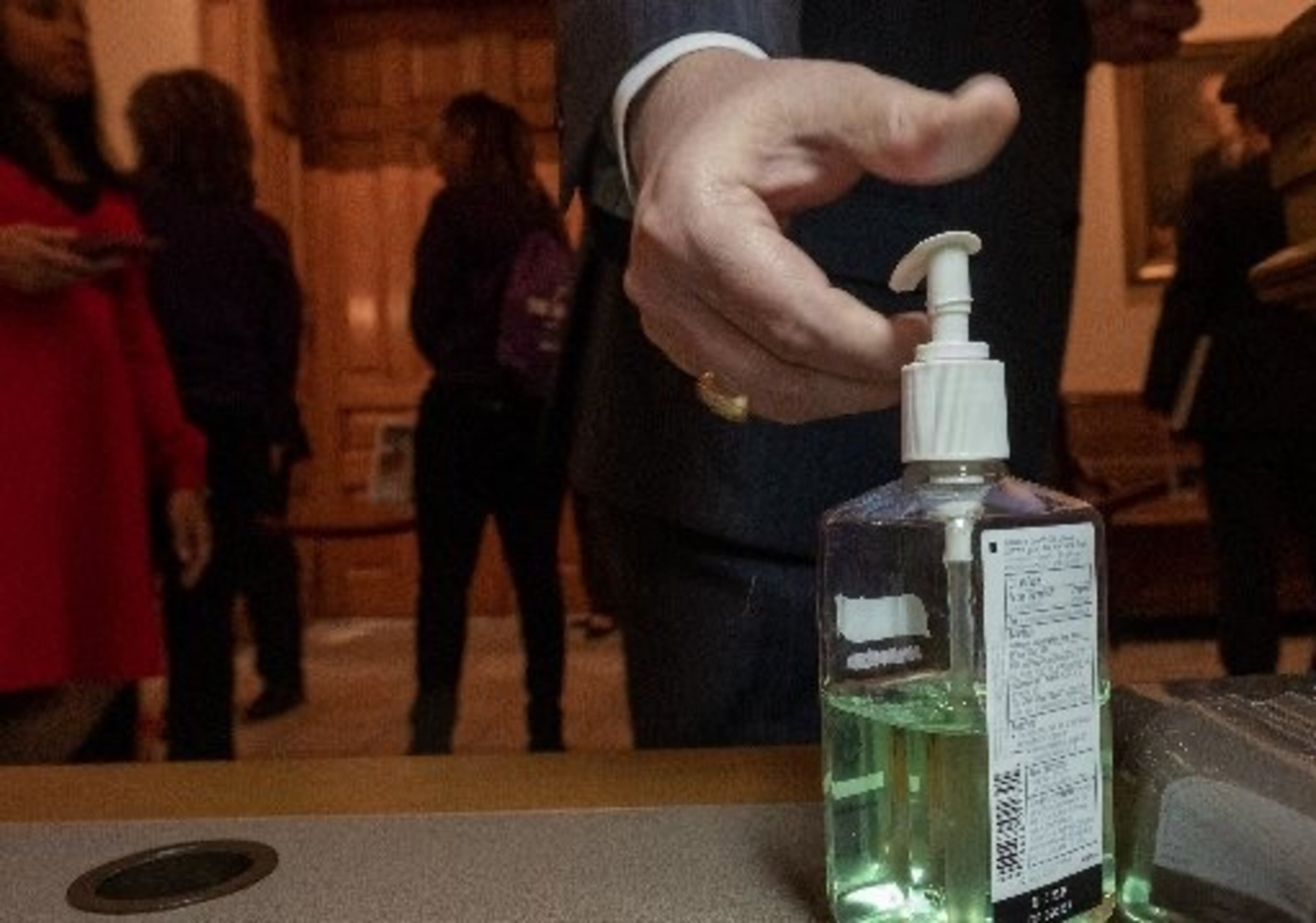 A lawmaker uses hand sanitizer at the Capitol. AJC/Ben Gray