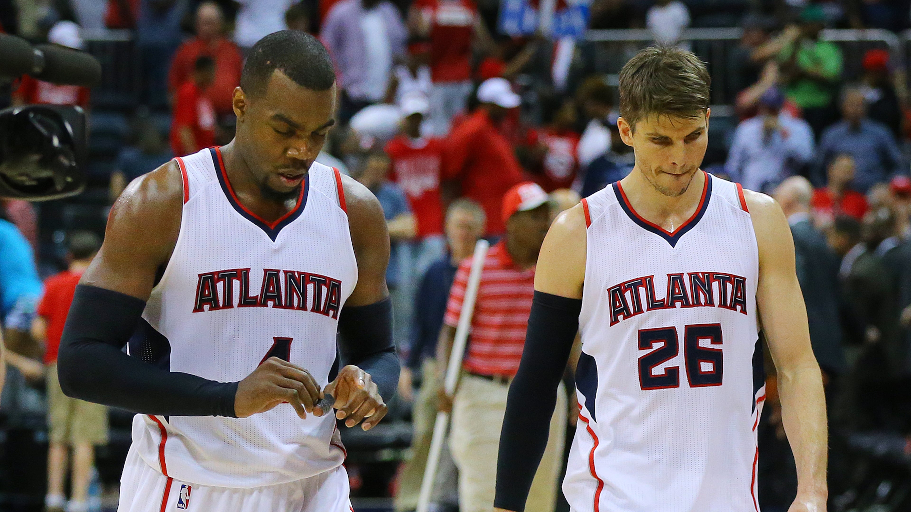 050315 ATLANTA: Hawks Paul Millsap and Kyle Korver walk off the court falling to the Wizards 104-98 in game 1 of the Eastern Conference Semifinals on Sunday, May 3, 2015, in Atlanta. Paul Millsap and Kyle Korver walk leave court after Hawks blew a 12-point lead in loss to Washington. (Curtis Compton, AJC)