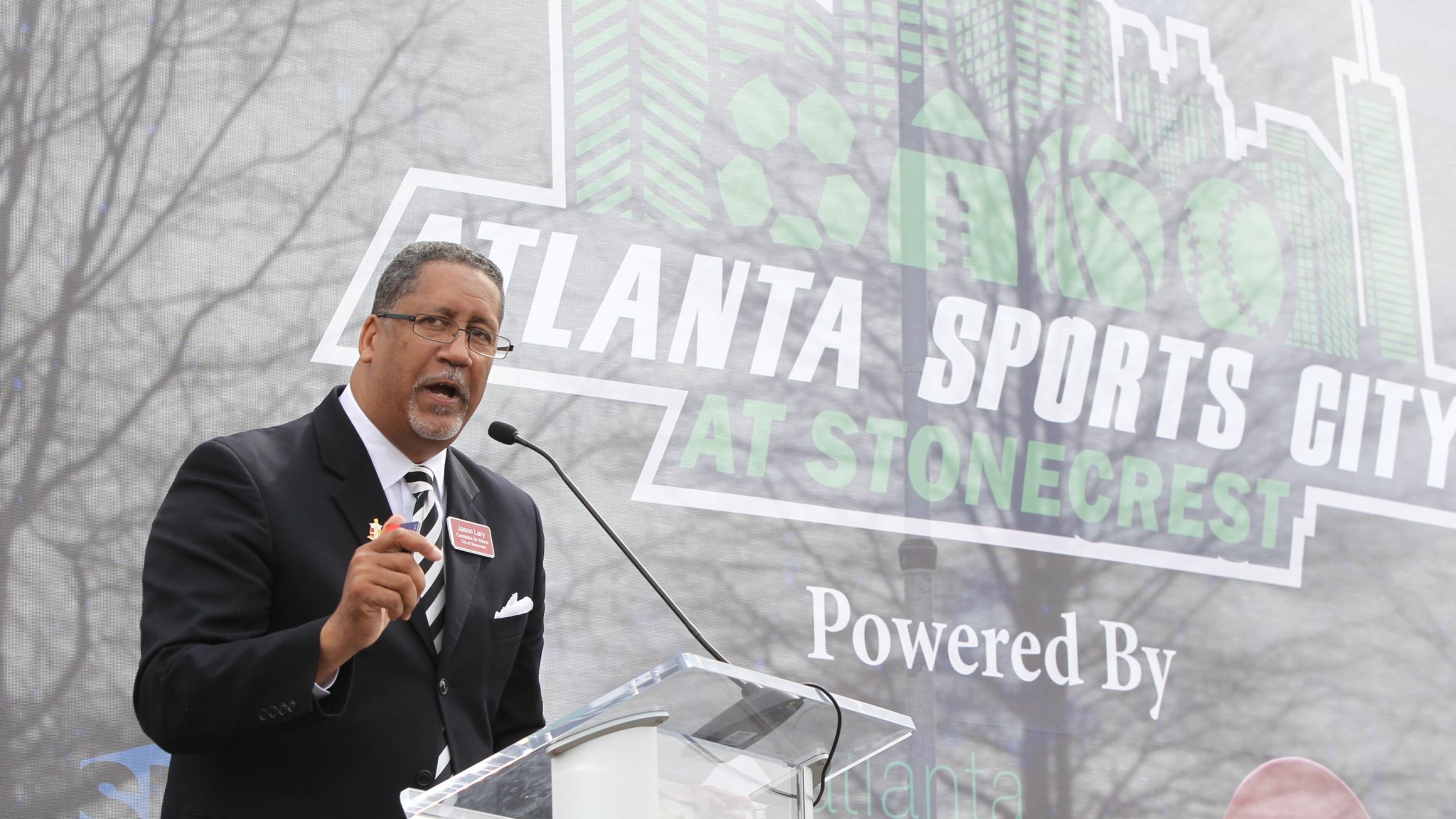 Jason Lary, then a candidate for Stonecrest mayor, speaks to the crowd at the unveiling of the Atlanta Sports City site on Feb. 22, 2017. HENRY TAYLOR / HENRY.TAYLOR@AJC.COM