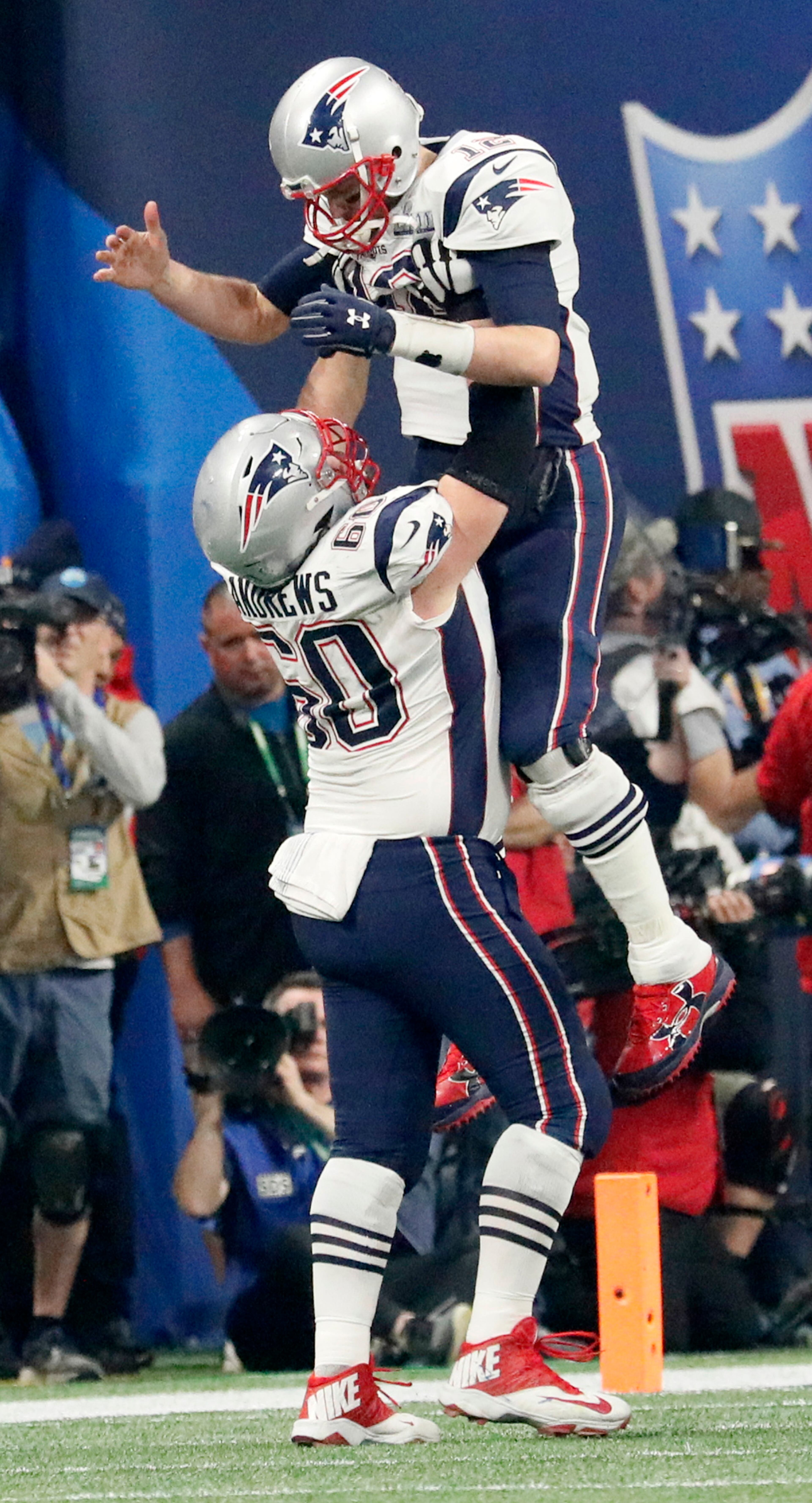 2/3/19 - Atlanta - New England Patriots quarterback Tom Brady (12) celebrates a fourth quarter touchdown against the Los Angeles Rams on Sunday, Feb. 3, 2019 during Super Bowl LIII at Mercedes-Benz Stadium in Atlanta, Ga. Bob Andres / bandres@ajc.com