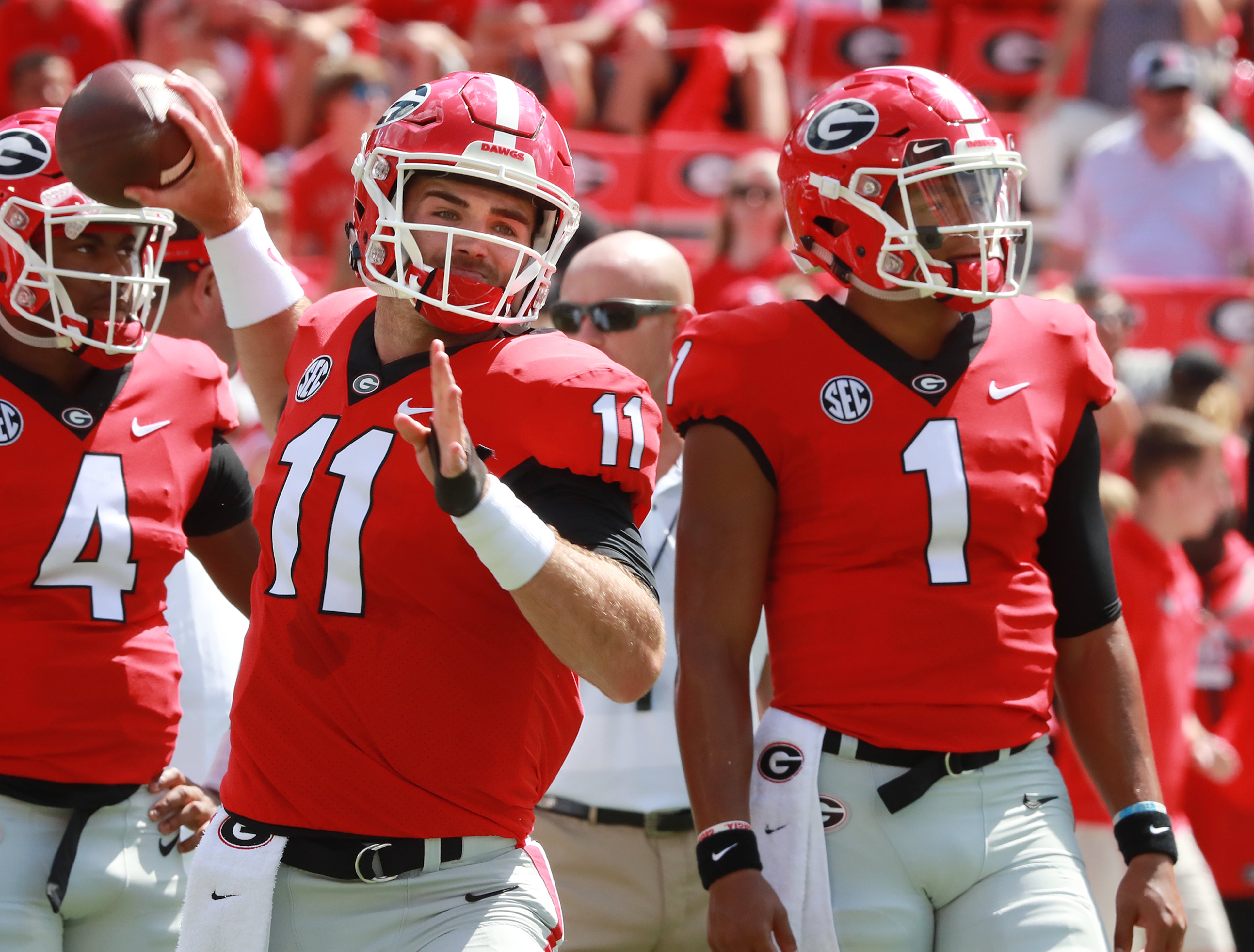 Jake Fromm and Justin Fields. (Curtis Compton/AJC)