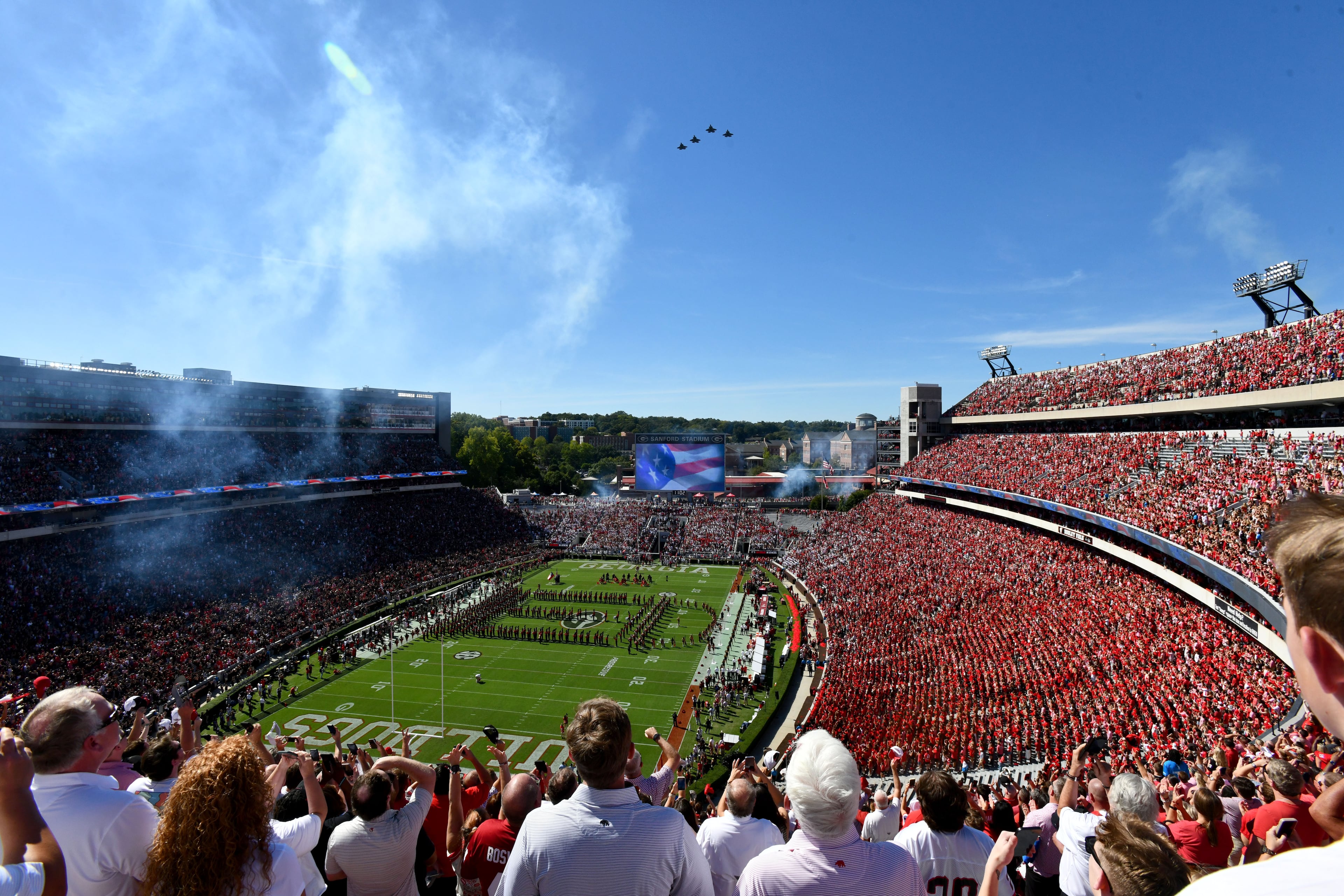 Georgia fans cheer during a flyover before an NCAA college football game against Oklahoma at Sanford Stadium on Saturday, Sept. 26, 2026, in Athens, Ga. (Hyosub Shin/AJC)