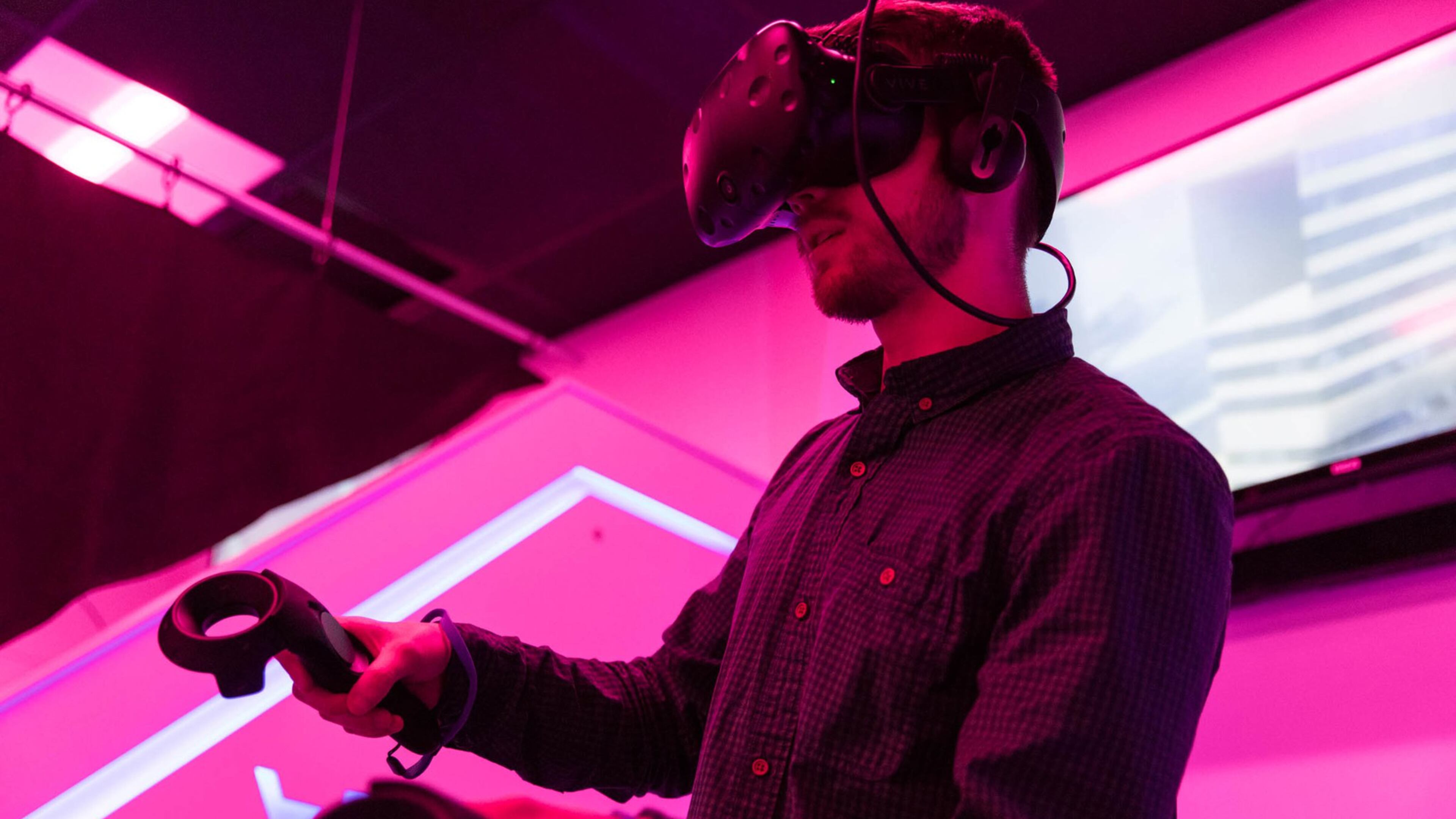 Curtis Baillie, an employee at Liberty Virtual Reality and senior at Rowan University, plays a virtual reality game where he’s flying at the virtual reality arcade on Friday, March 30, 2018 at Rowan University in Glassboro, N.J. (Sydney Schaefer/Philadelphia Inquirer/TNS)