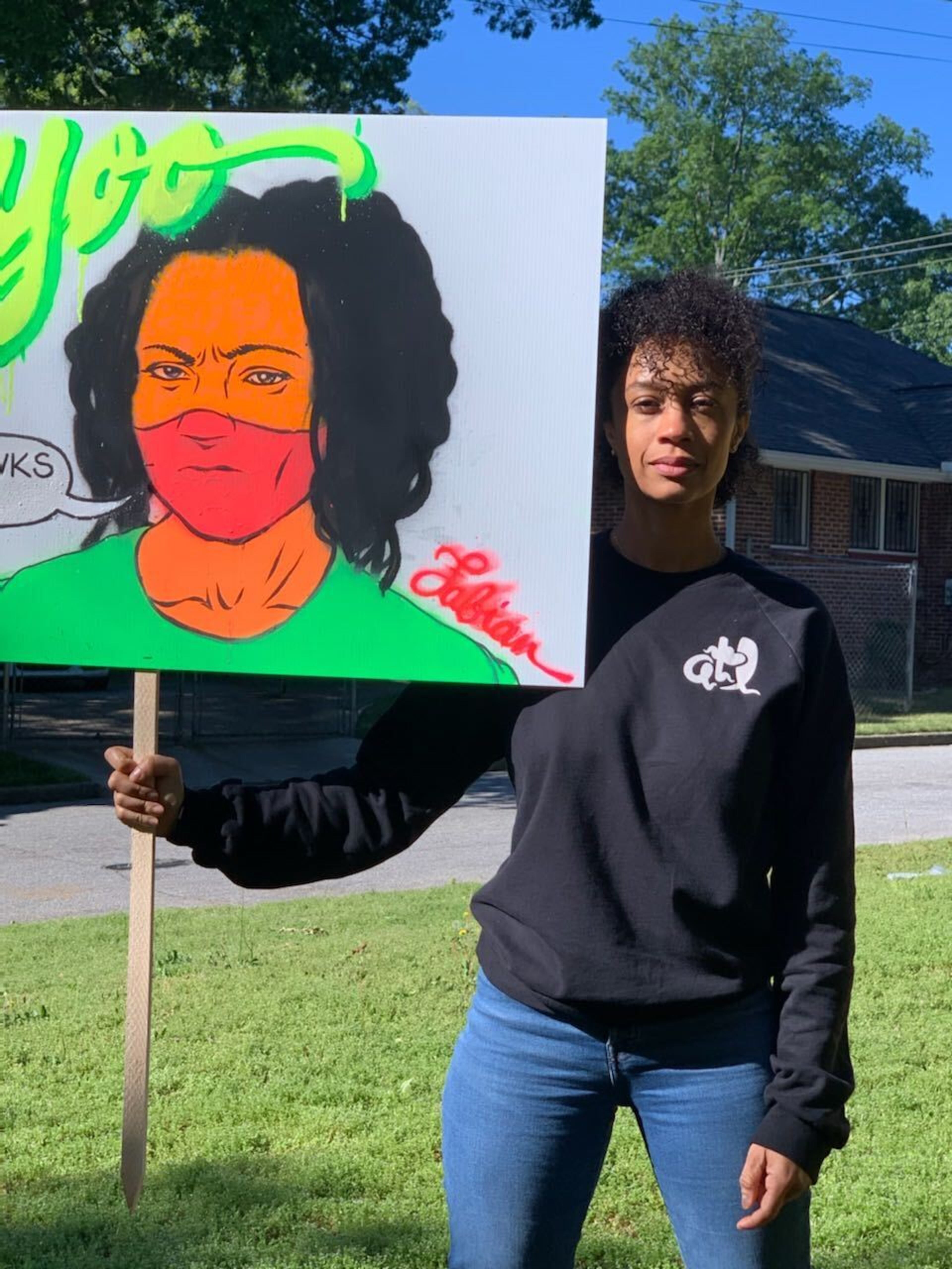 Writer and producer Sherri Daye Scott has started Big Facts, Small Acts “to push home the message that COVID-19 is impacting our communities the hardest.” The grassroots organization has placed signs, like the one she is holding by artist Fabian Williams, in black communities to drive the message home.