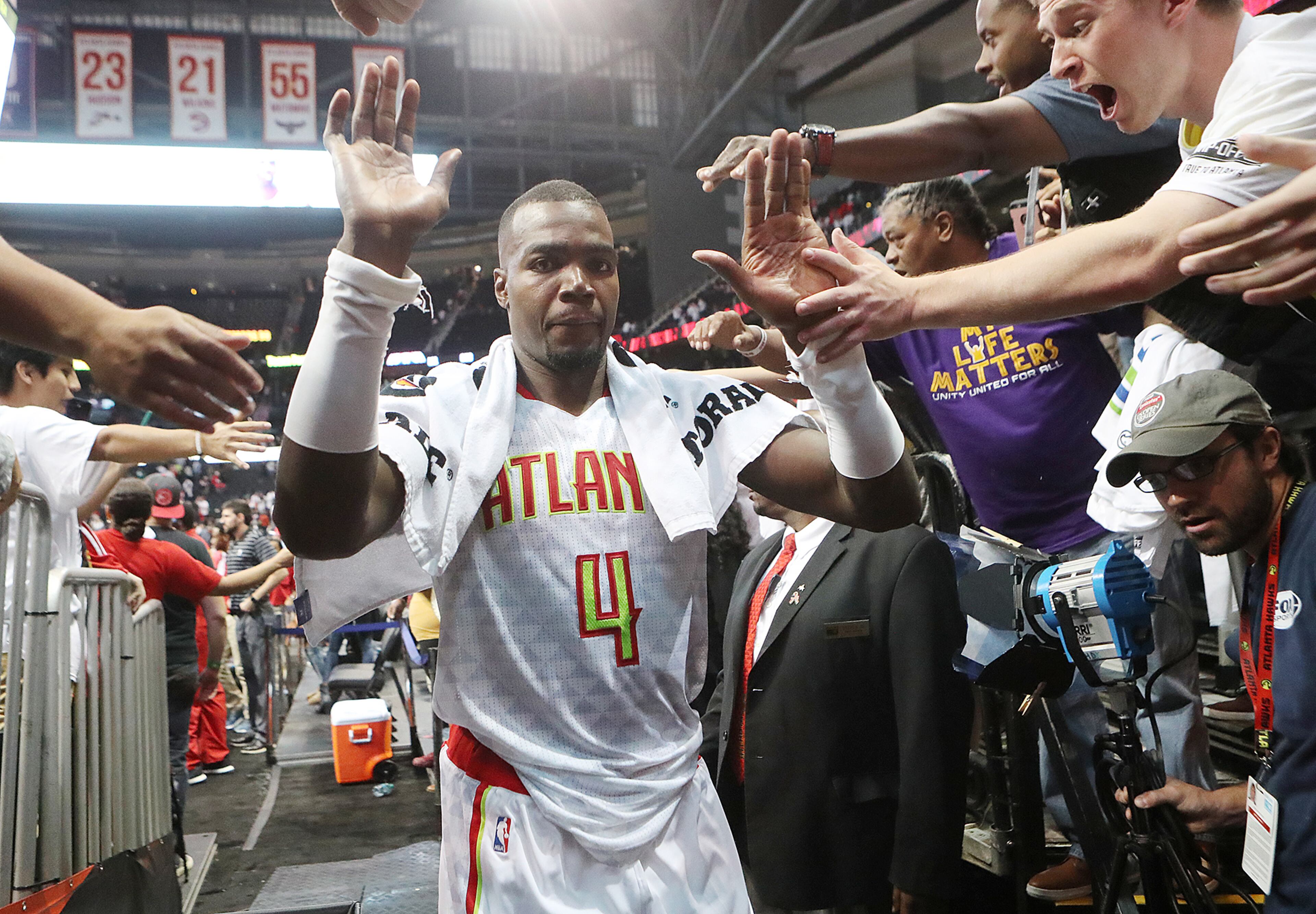 Hawks Paul Millsap gets high fives from fans after beating the Wizards 114-99 in the home opener of their NBA basketball game at Philips Arena on Thursday, Oct. 27, 2016, in Atlanta. Curtis Compton /ccompton@ajc.com