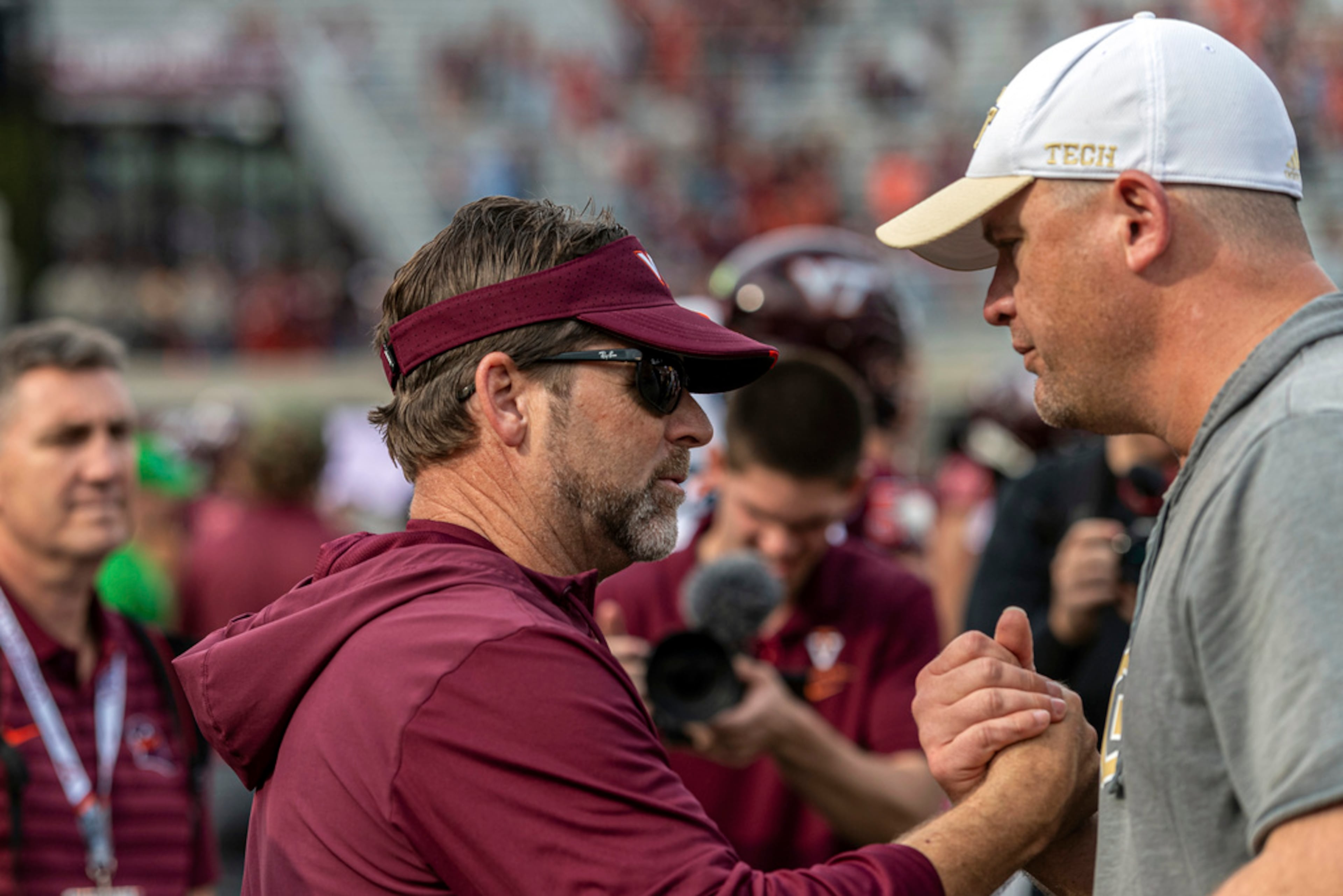 Georgia Tech Brent Key and Virginia Tech Brent Pry meet after an NCAA college football game, Saturday, Oct. 26, 2024, in Blacksburg, Va. (AP Photo/Robert Simmons)
