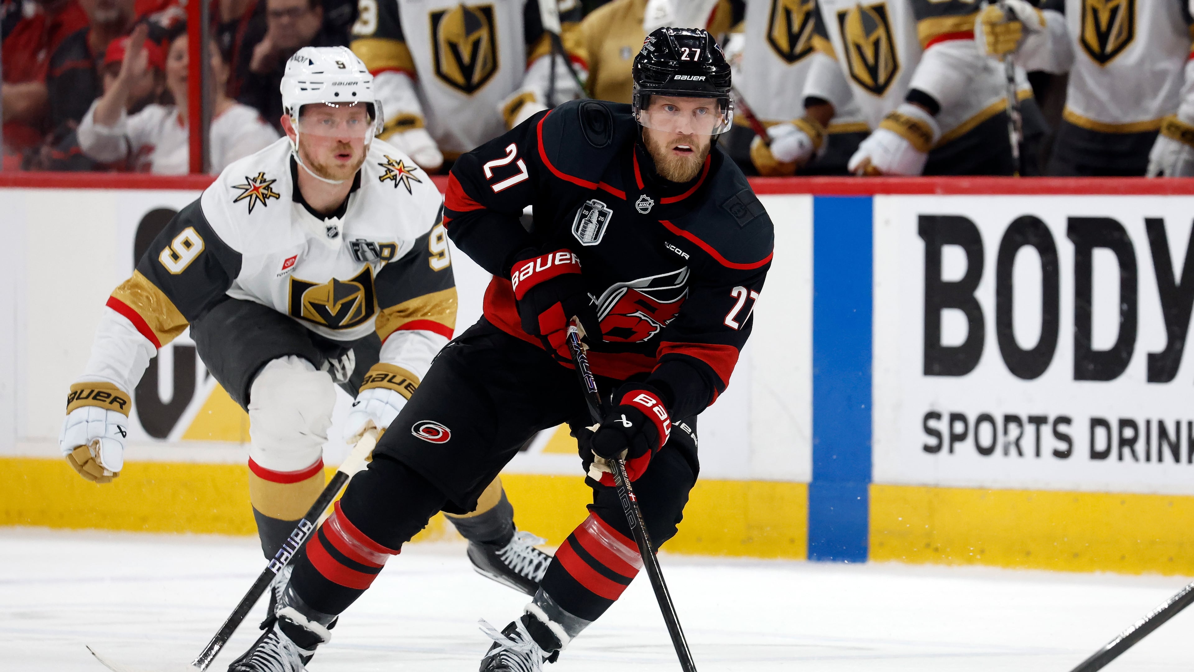Carolina Hurricanes' Nikolaj Ehlers (27) controls the puck while followed by Vegas Golden Knights' Jack Eichel (9) during the second period in Game 2 of the NHL hockey Stanley Cup Final series in Raleigh, N.C., Thursday, June 4, 2026. (AP Photo/Karl DeBlaker)