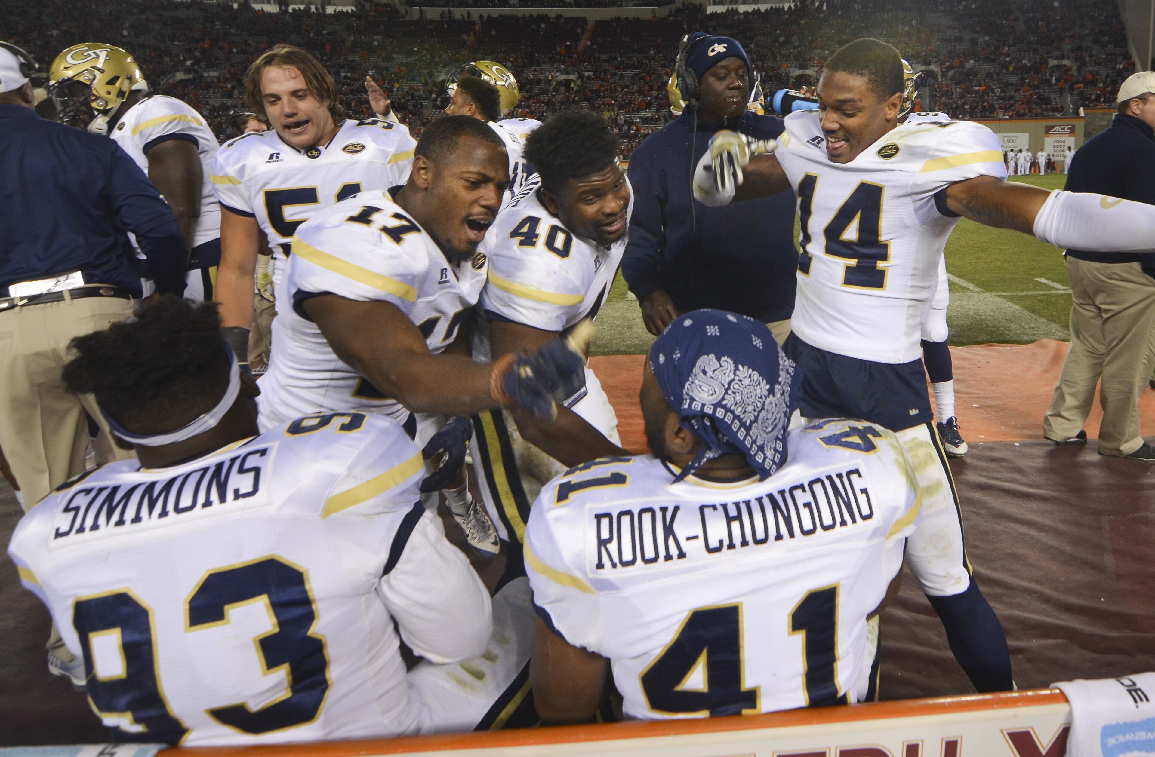 BLACKSBURG, VA - NOVEMBER 12: Defensive back Lance Austin #17, linebacker P.J. Davis #40, and defensive back Corey Griffin #14 of the Georgia Tech Yellow Jackets react with teammates defensive lineman Antonio Simmons #93 and defensive end Rod Rook-Chungong #41 in the second half against the Virginia Tech Hokies at Lane Stadium on November 12, 2016 in Blacksburg, Virginia. Georgia Tech defeated Virginia Tech 30-20. (Photo by Michael Shroyer/Getty Images)