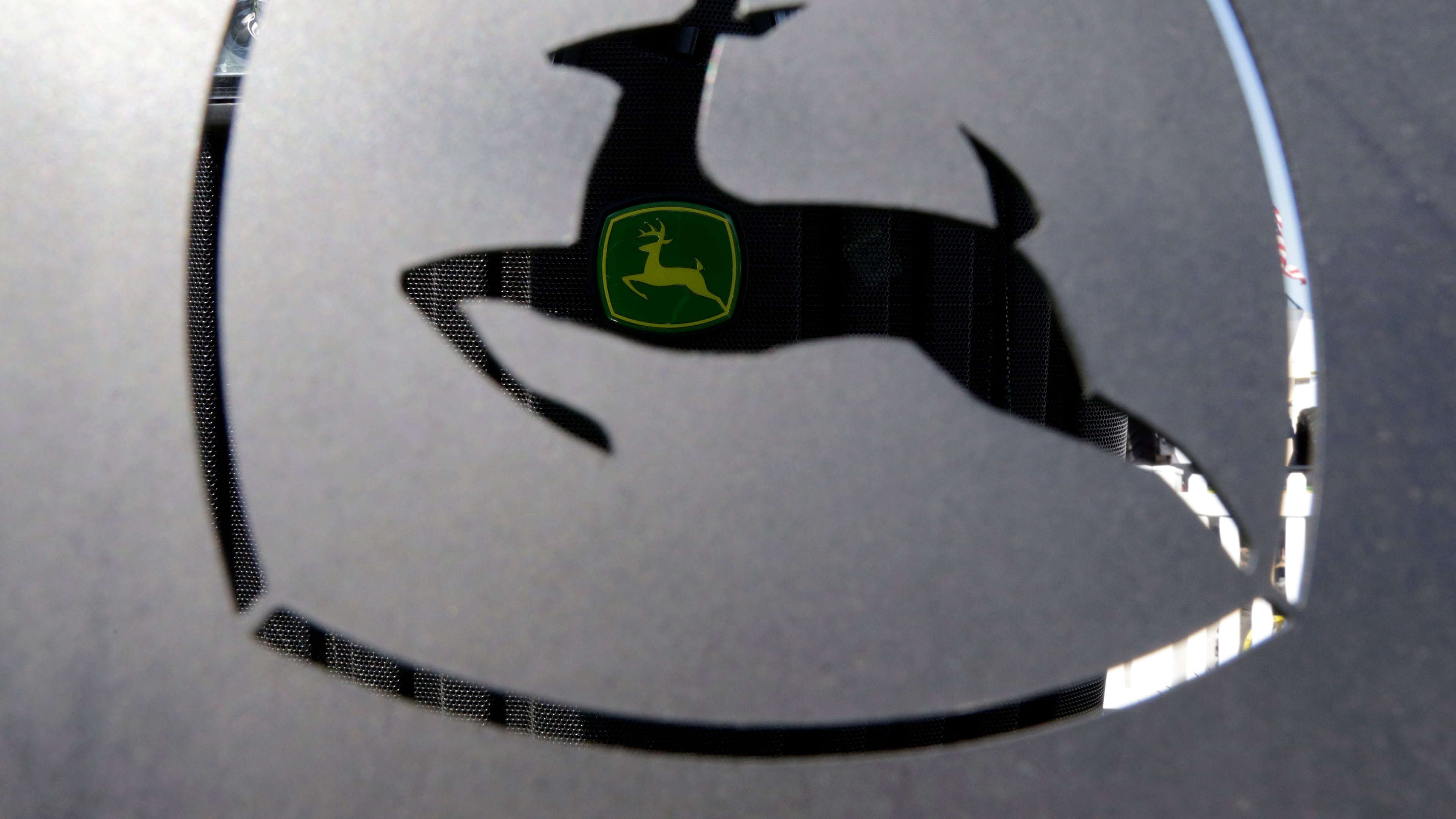 FILE - A John Deer emblem is seen at the Husker Harvest Days farm show in Wood River, Neb., Sept. 12, 2018. (AP Photo/Nati Harnik, File)