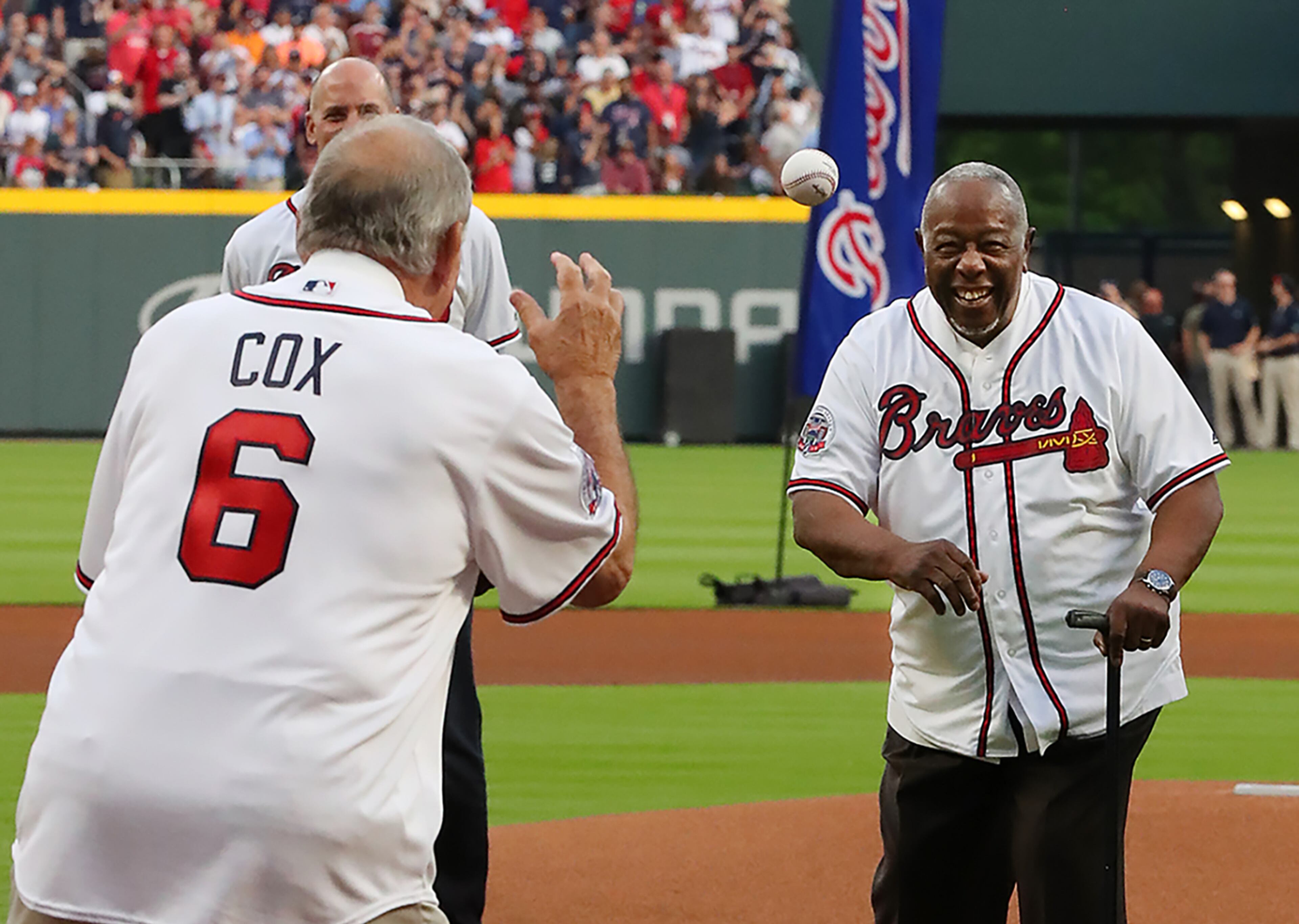 April 14, 2017, Atlanta: Hank Aaron throws out the first pitch to Bobby Cox at the Braves home opener against the Padres at SunTrust Park on Friday, April 14, 2017, in Atlanta. Curtis Compton/ccompton@ajc.com