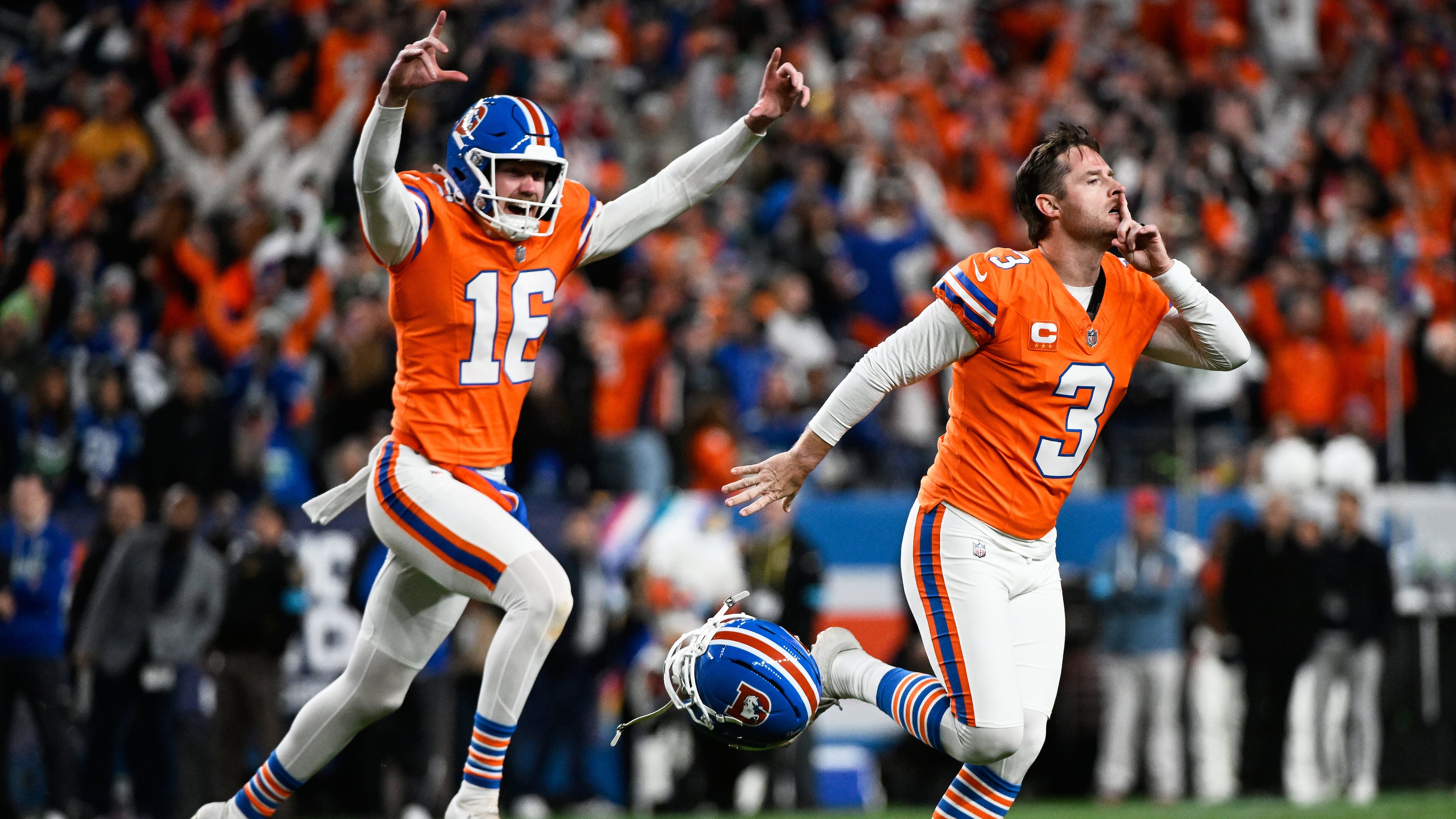 Denver Broncos place-kicker Wil Lutz (3) reacts with punter Jeremy Crawshaw (16) after making a field goal to win the game in overtime against the Seattle Seahawks in an NFL football game in Denver, Thursday, Oct. 15, 2026. (AP Photo/Geneva Heffernan)