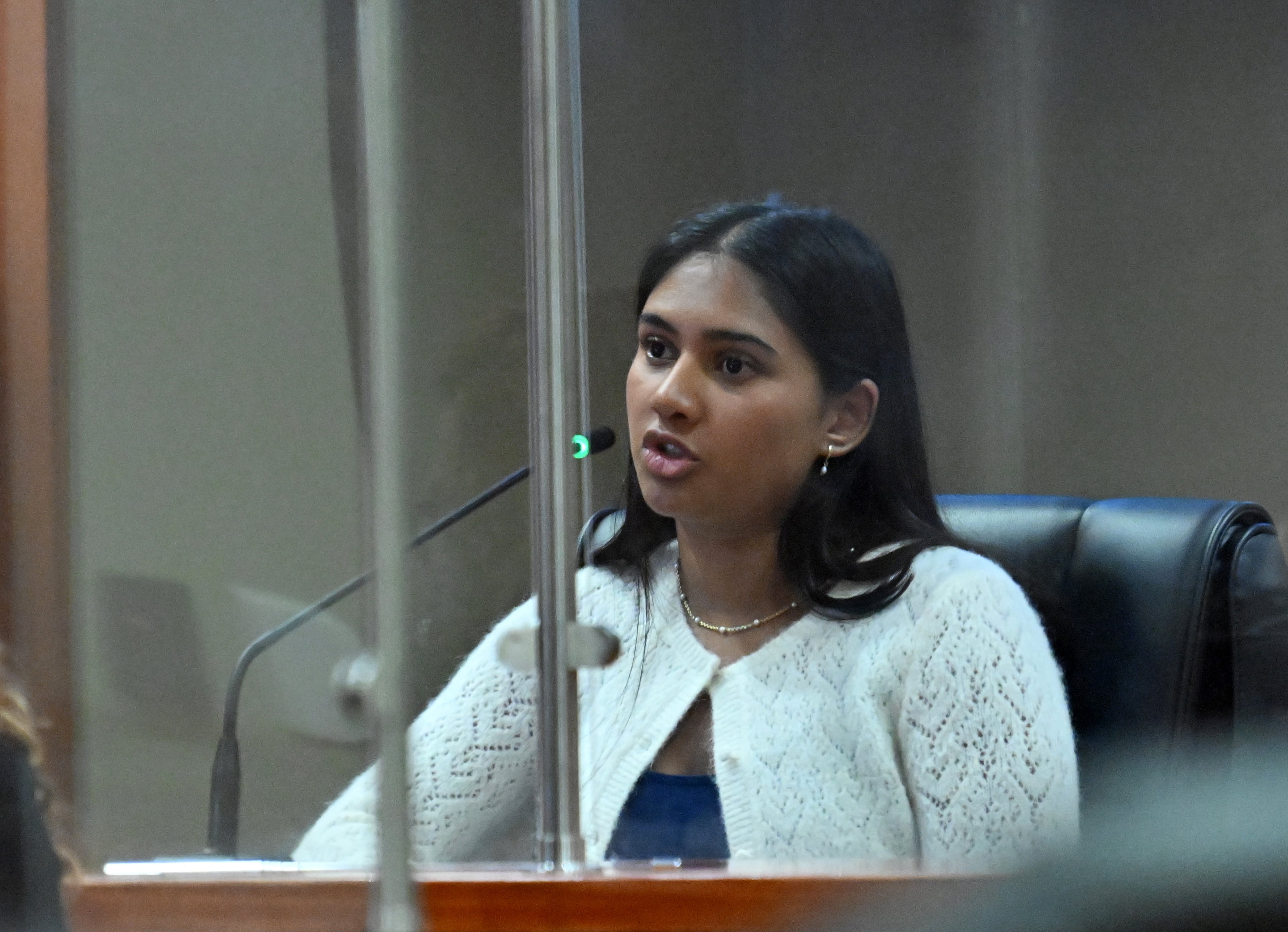 Ananya Rao, daughter of Sumanth and Anindita Rao, testifies on the witness stand during a hearing before Superior Court Judge Tangela Barrie at DeKalb County Courthouse in April 2026. (Hyosub Shin/AJC)