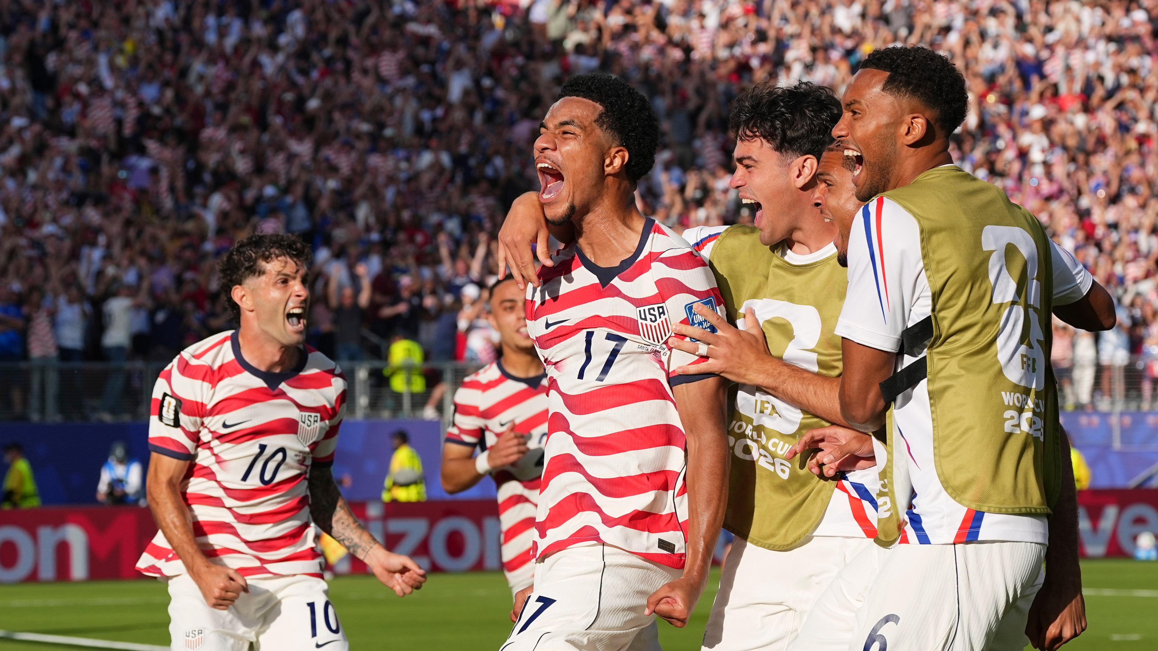 United States' Malik Tillman (17) celebrates with teammates after scoring on a free kick during the World Cup round of 32 soccer match between the United States and Bosnia in Santa Clara, Calif., near San Francisco, Wednesday, July 1, 2026. (AP Photo/Martin Meissner)