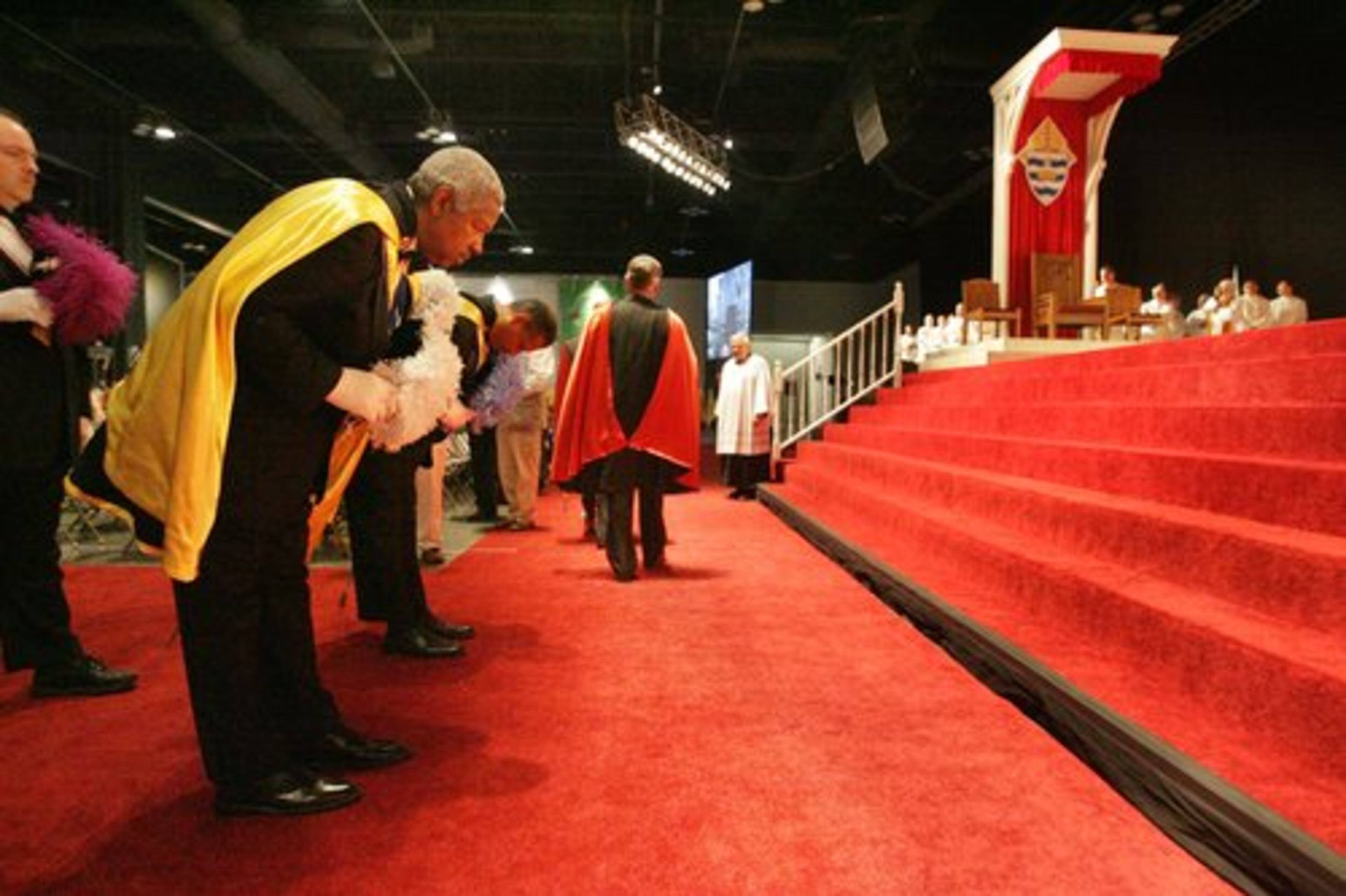 Some of the Knights of Columbus enter the hall.