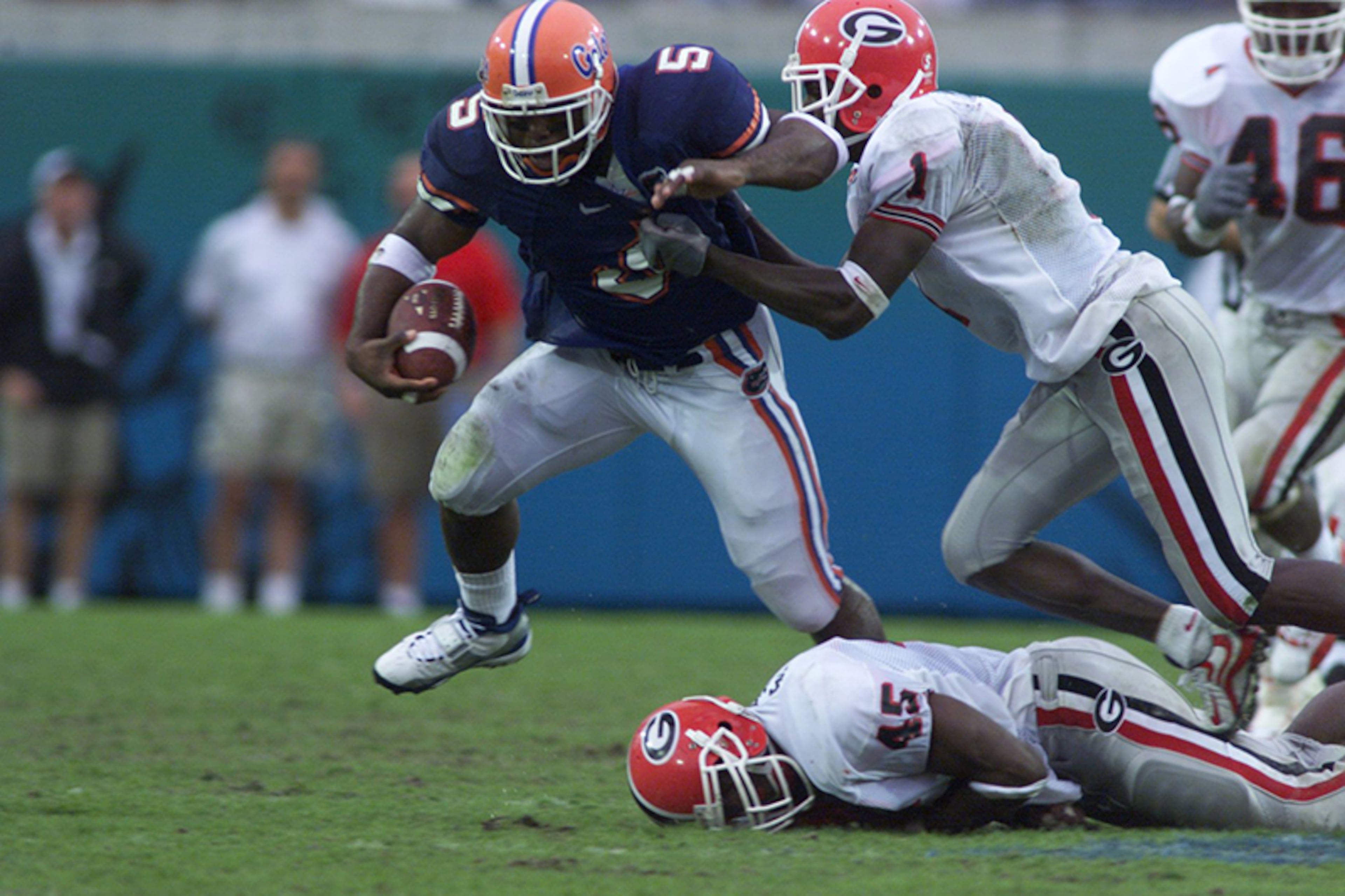 (5) Florida 30, (10) Georgia 14, Jacksonville, Fla.: Florida quarterback Doug Johnson gave coach Steve Spurrier his 100th win with the Gators, throwing for 234 yards and a touchdown and running for a score during a rainstorm at Alltel Stadium. Georgia's Quincy Carter was just 6-of-23 for 76 yards and one interception. Lee Corso's pick? Florida.