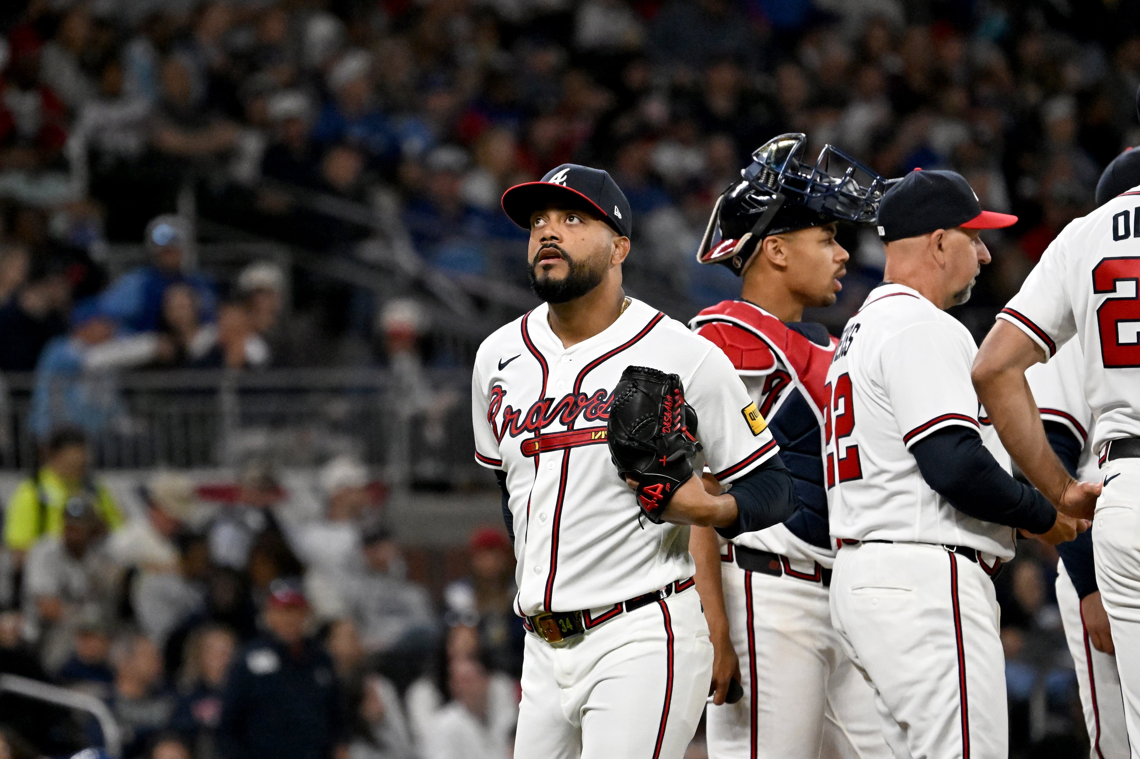 Atlanta Braves pitcher Joel Payamps (34) reacts as he is relieved throws a pitch during the eighth inning of a baseball game at Truist Park, Saturday, March 28, 2026, in Atlanta. Atlanta Braves Dominic Smith hit a grand slam during the 9th inning to win 6-2 over Kansas City Royals. (Hyosub Shin/AJC)