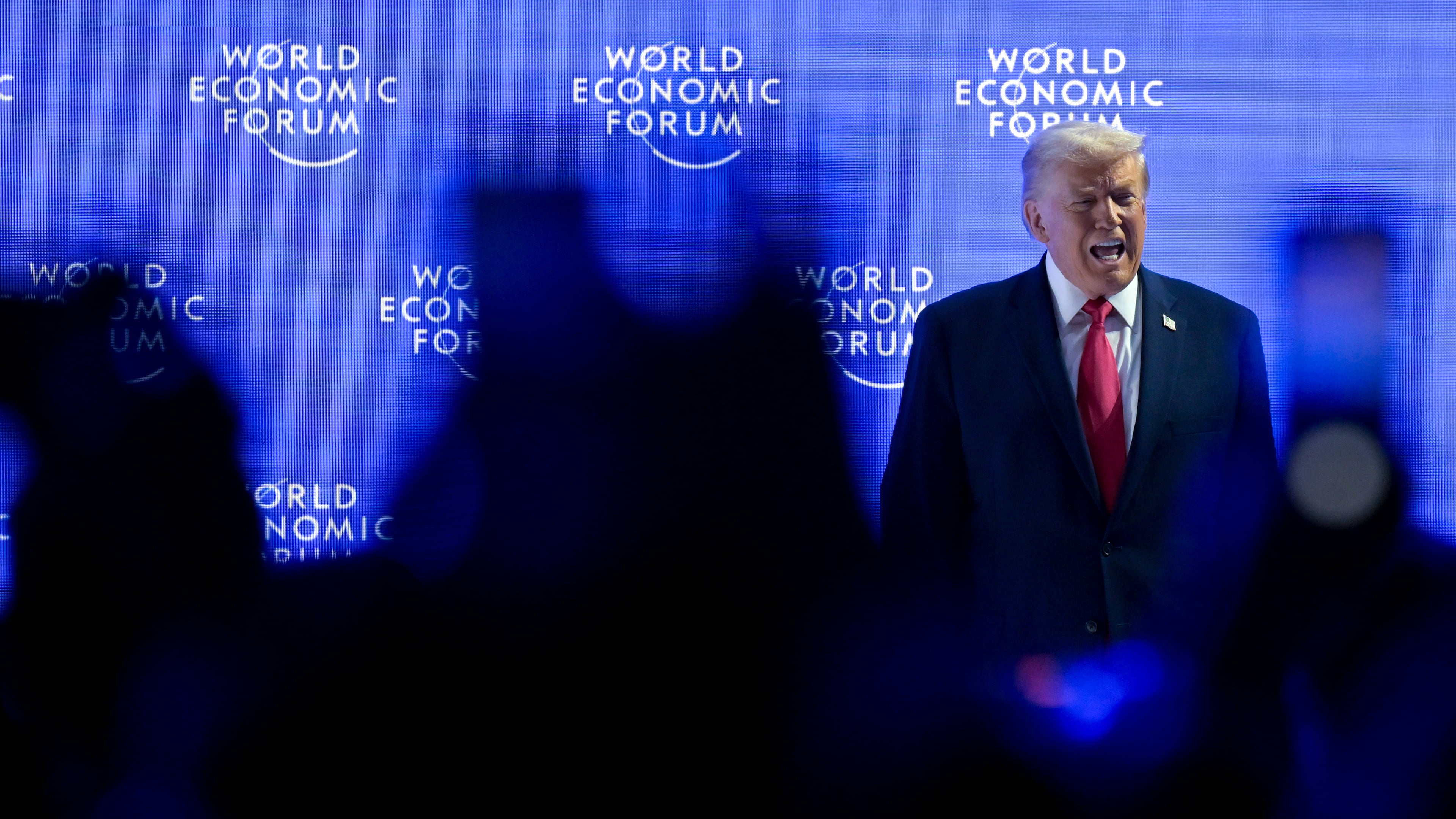 President Donald Trump walks on to the stage during the 56th annual meeting of the World Economic Forum, WEF, in Davos, Switzerland, Wednesday, Jan. 21, 2026. (Gian Ehrenzeller/Keystone via AP)
