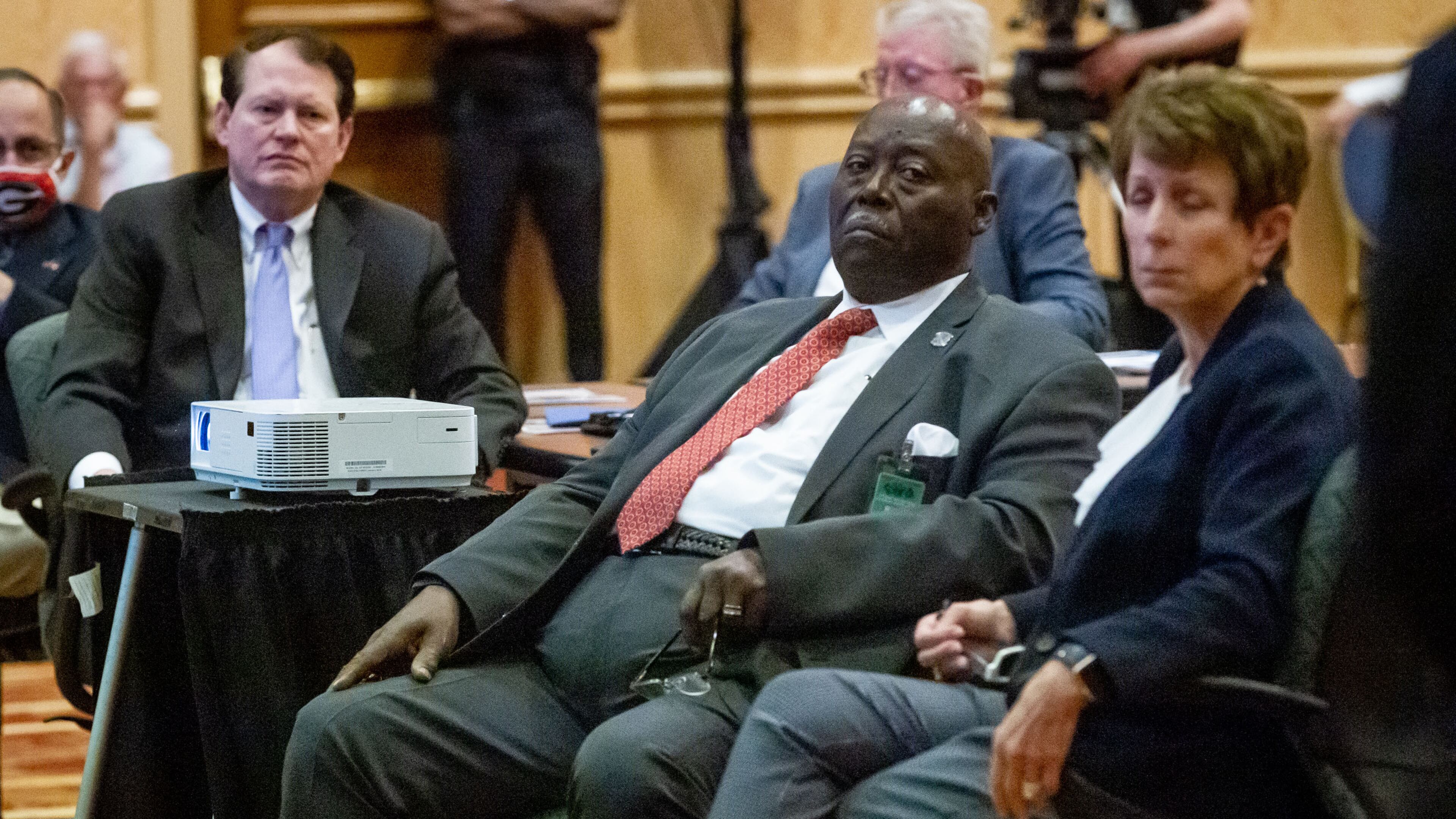 The Reverend Abraham Mosley (center) listens to Bill Stephens give a presentation during a Stone Mountain Memorial Association meeting Monday at the Evergreen Conference Center at Stone Mountain Park. STEVE SCHAEFER FOR THE ATLANTA JOURNAL-CONSTITUTION