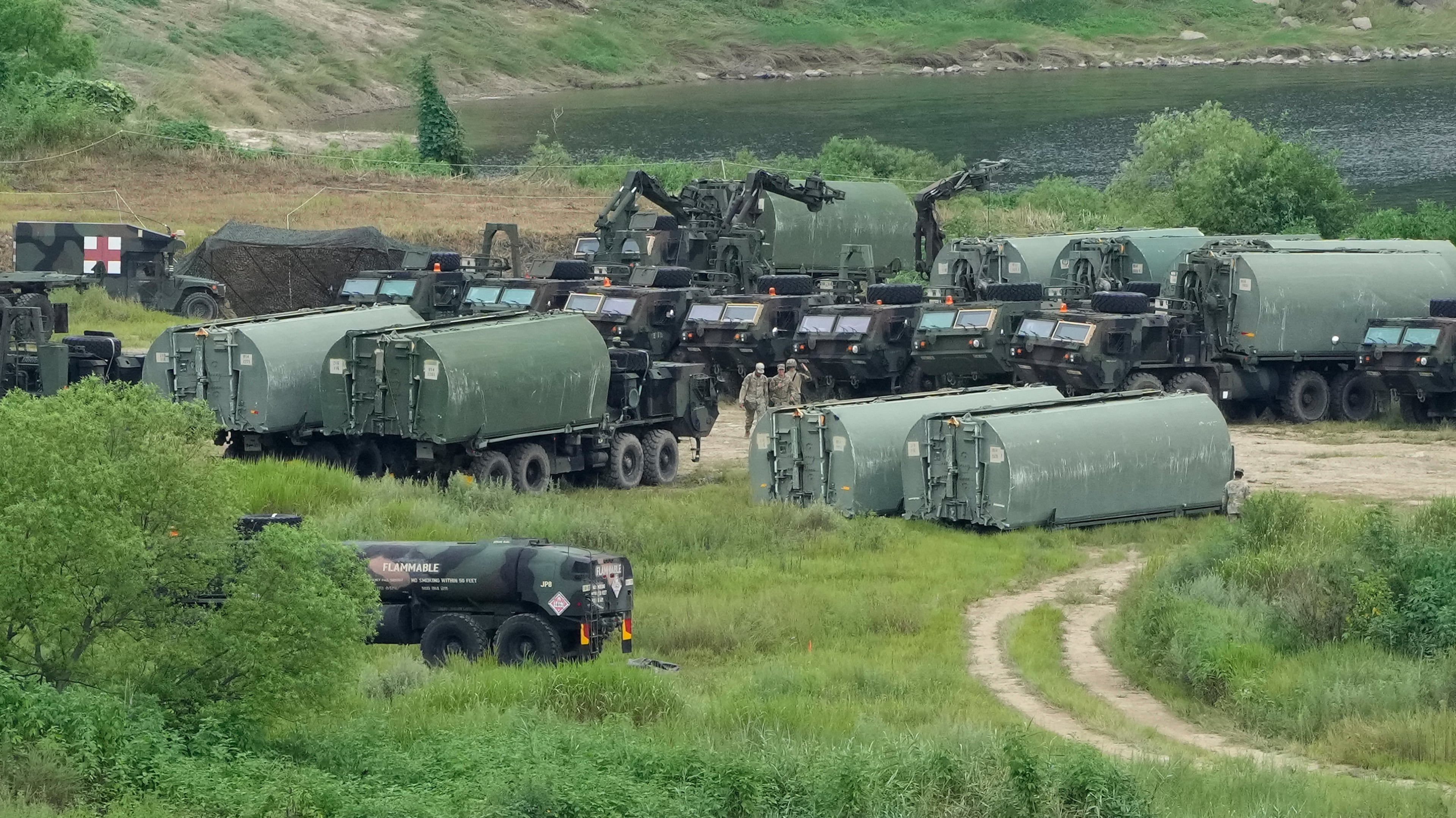 U.S. Army's armored vehicles gather to cross a river at a training field in Yeoncheon, South Korea, near the border with North Korea, Monday, Aug. 17, 2026. (AP Photo/Ahn Young-joon)