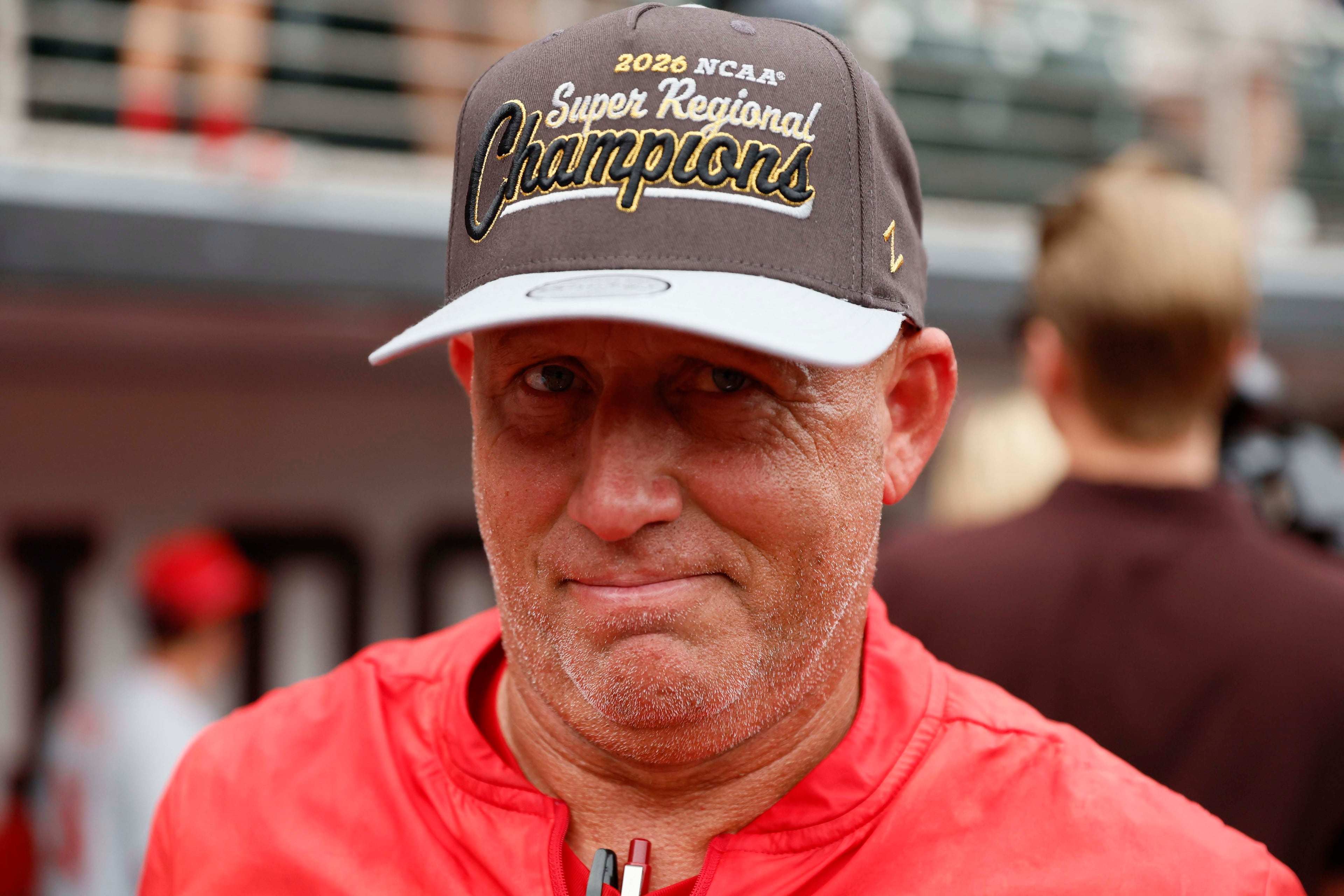 Georgia Bulldogs head coach Wes Johnson reacts while wearing his championship hat as he celebrates with his team after winning the NCAA Super Regional series, defeating the Mississippi State Bulldogs 11-9 at Foley Field on Sunday, June 7, 2026, in Athens.
Miguel Martinez/AJC)