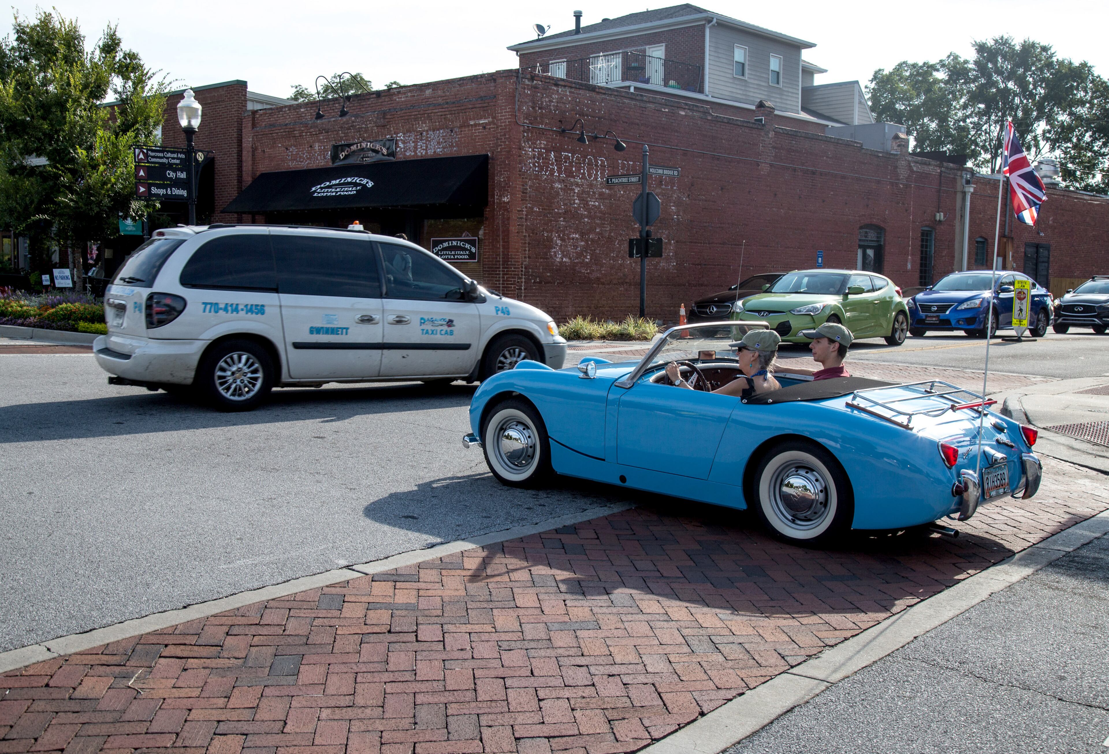 Pat Kurk (left) and Kruk Jacobson drive to their parking spot in a fully restored 1959 Austin Healey Sprite at the beginning of the 8th annual Atlanta British Car Fayre in downtown Norcross on Saturday, Sept. 8, 2018. (Photo: STEVE SCHAEFER / SPECIAL TO THE AJC)