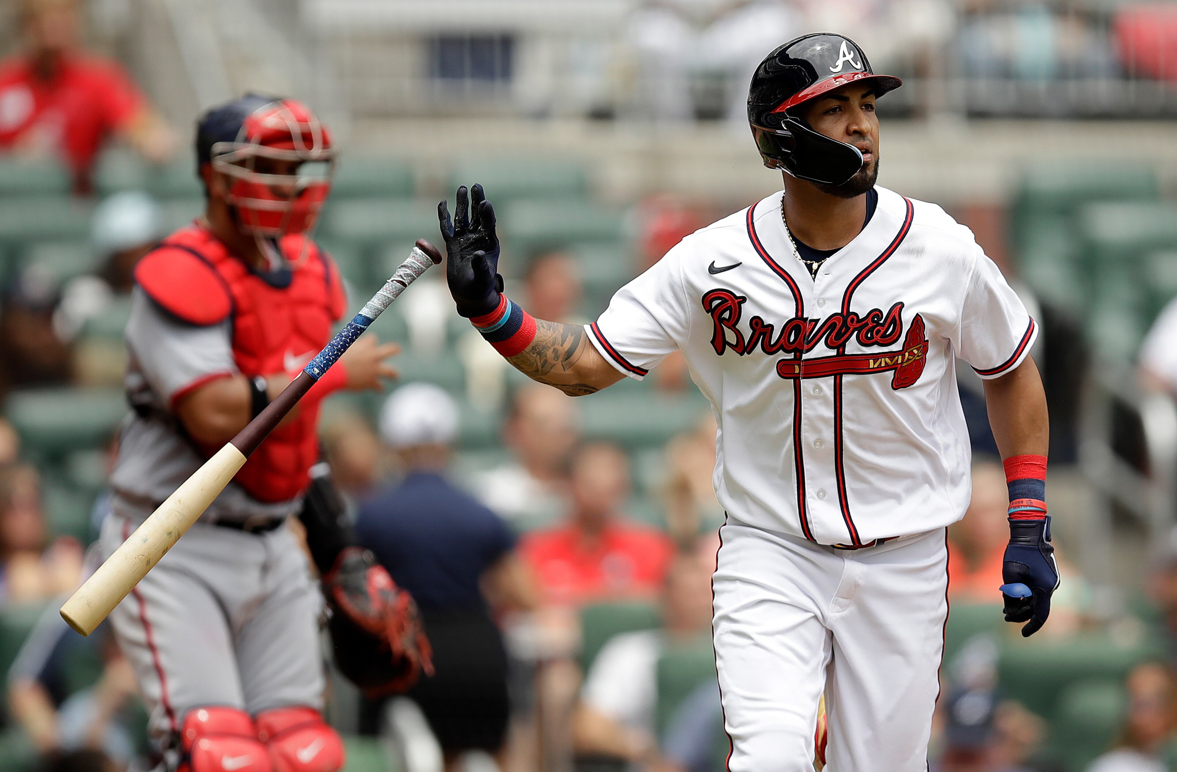 Eddie Rosario flips his bat after hitting an RBI sacrifice fly off Washington Nationals' Paolo Espino in the third inning of a baseball game, Sunday, July 10, 2022, in Atlanta. (AP Photo/Ben Margot)