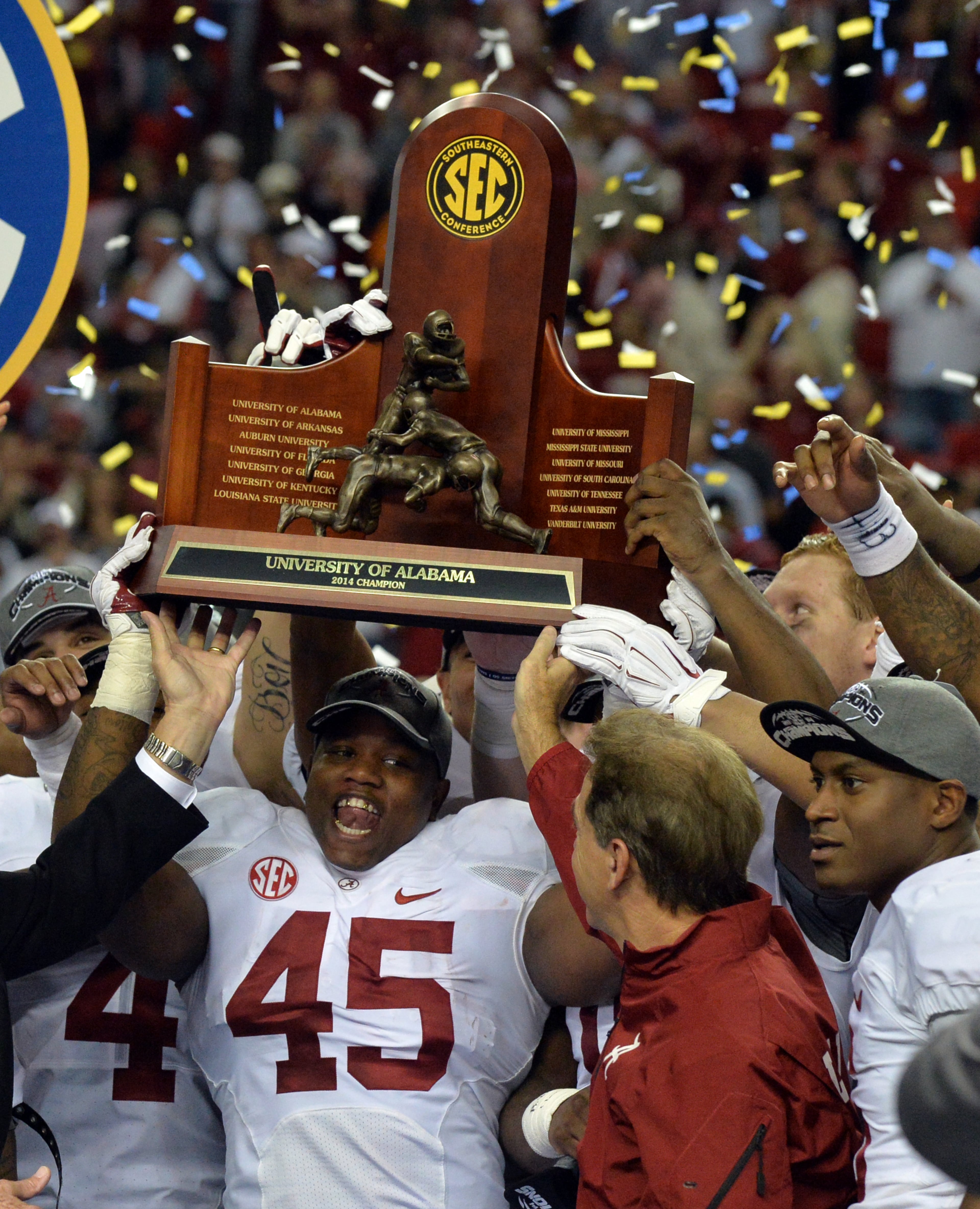 December 6, 2014 Atlanta: Alabama Crimson Tide running back Jalston Fowler holds the SEC Championship trophy after defeating Missouri at the Georgia Dome Saturday December 6, 2014. BRANT SANDERLIN / BSANDERLIN@AJC.COM