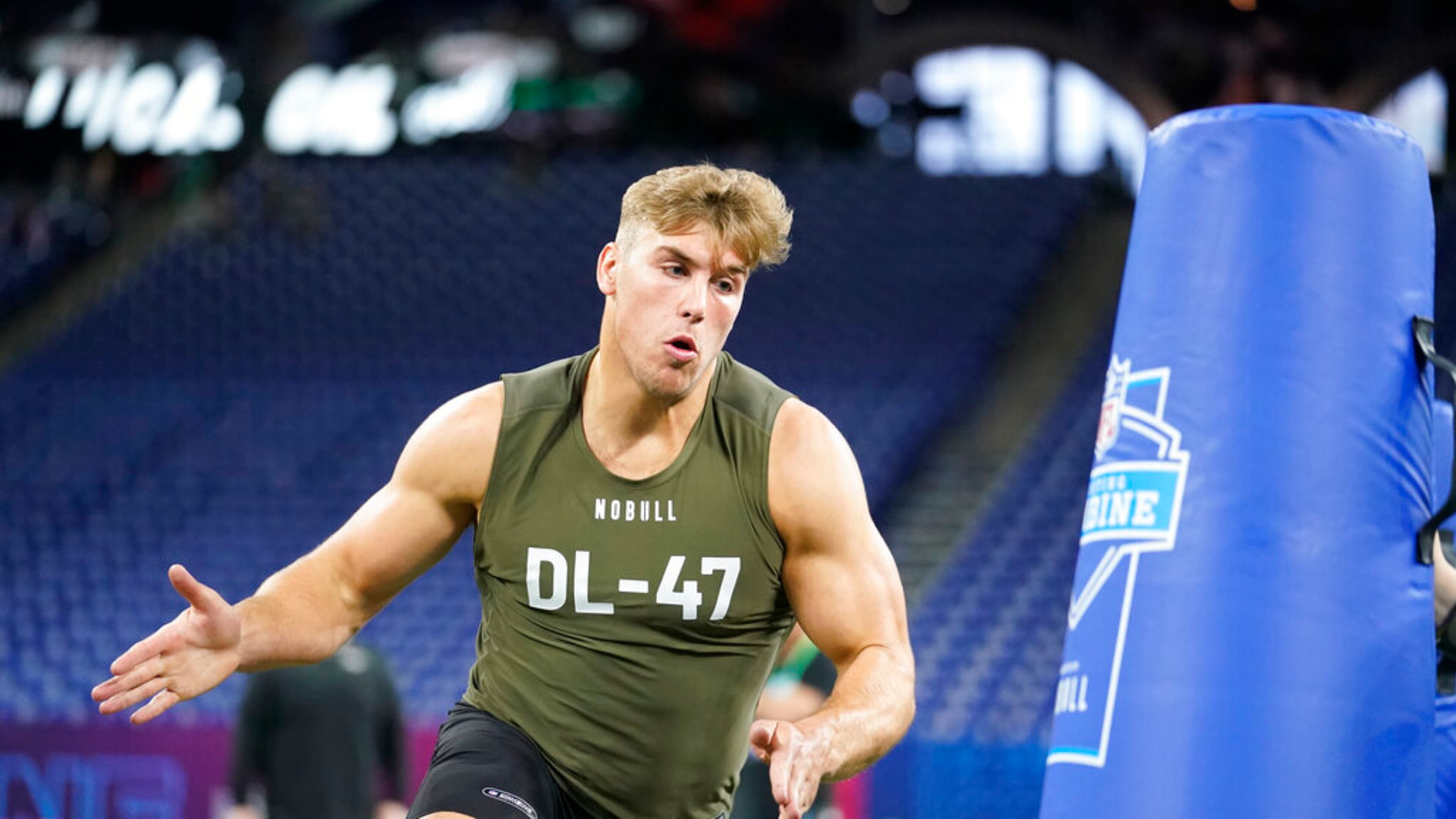 Iowa defensive lineman Lukas Van Ness runs a drill at the NFL football scouting combine in Indianapolis, Thursday, March 2, 2023. (AP Photo/Michael Conroy)