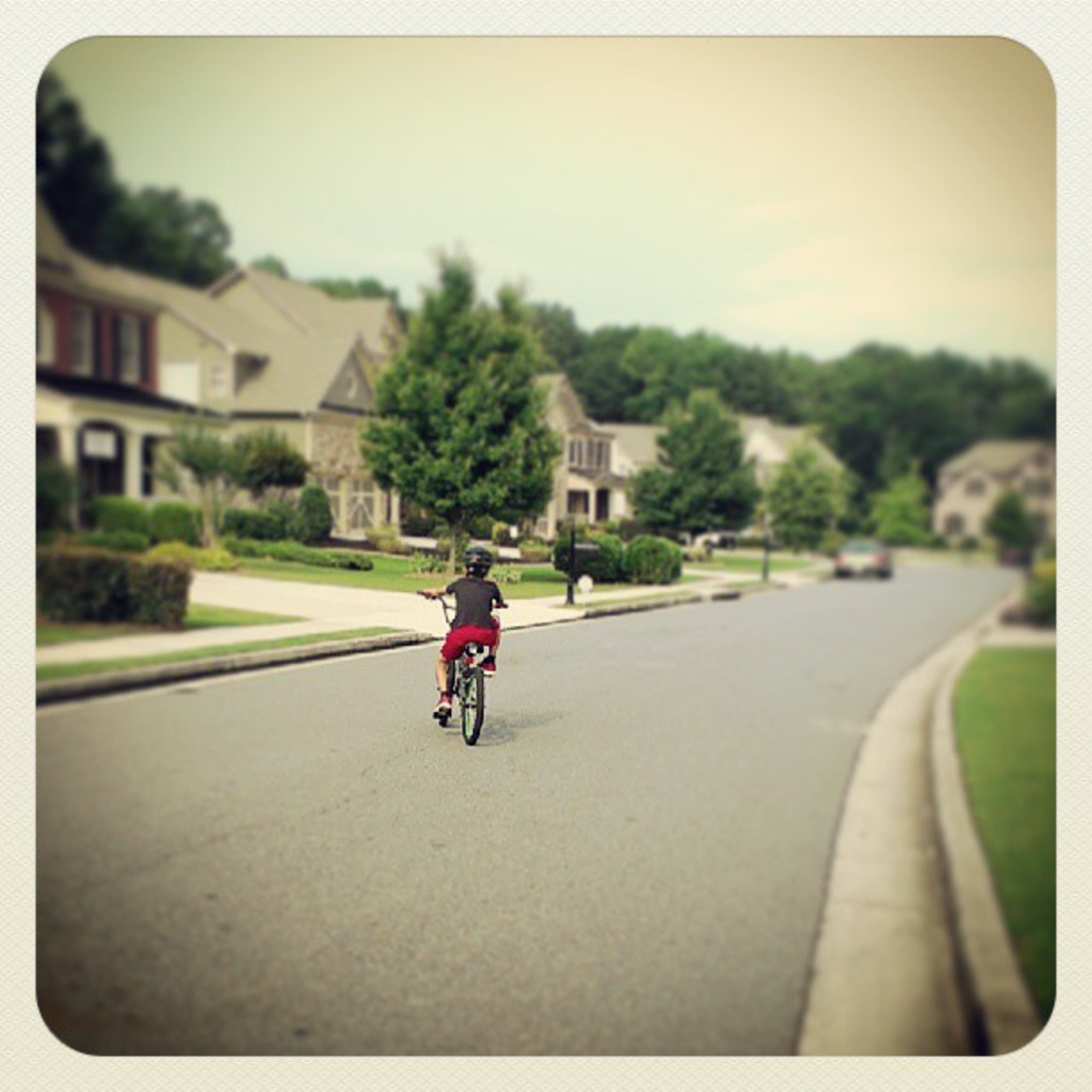 Out for a #ride. #bike #bmx #boysandtheirtoys #neighborhood #sky #view #trees #atlsummer #Sunday #georgia #street #outside #havingfun -- @dinalettre