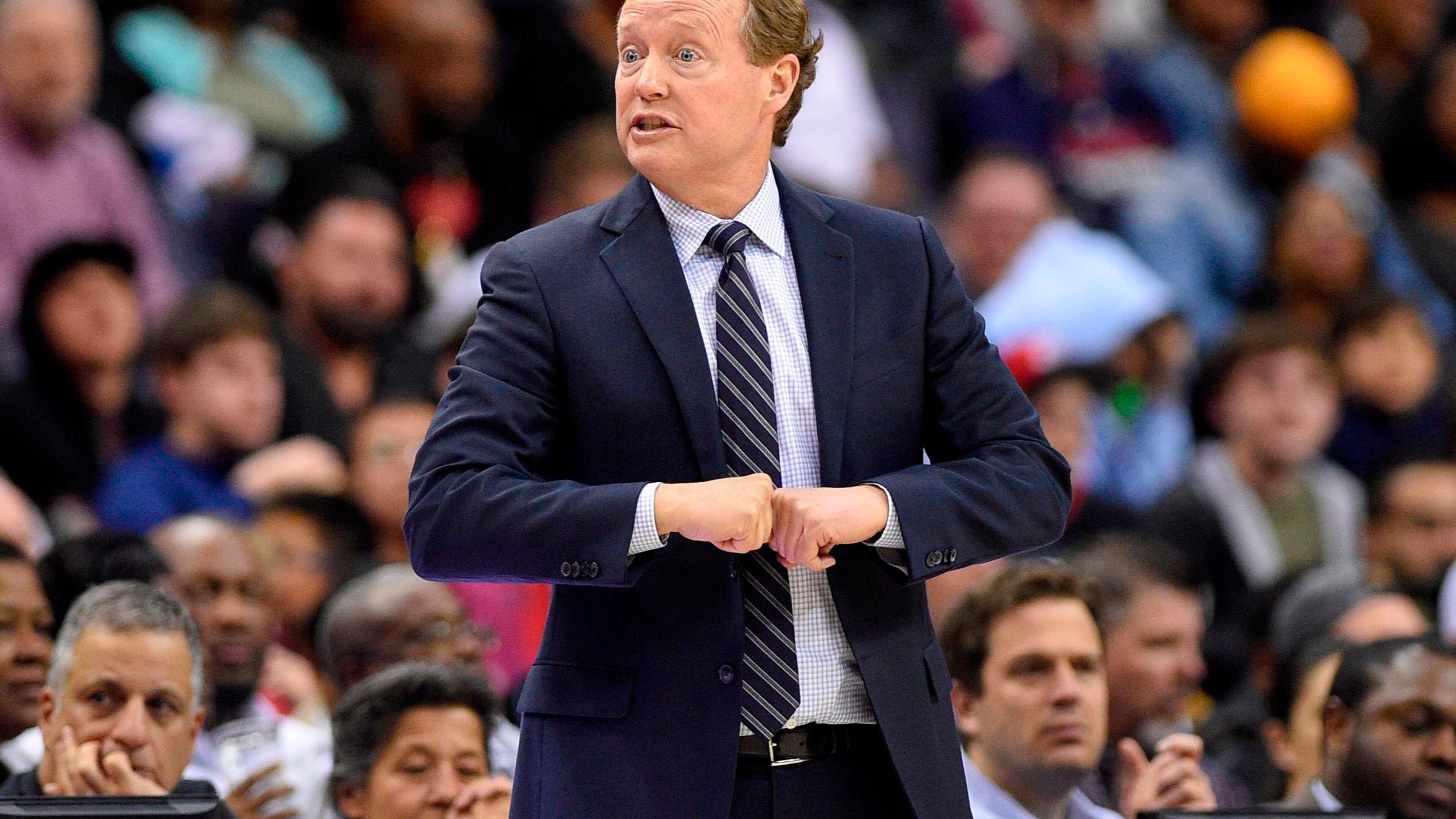 Atlanta Hawks coach Mike Budenholzer gestures during the second half of the team's NBA basketball game against the Washington Wizards, Friday, April 6, 2018, in Washington. The Hawks won 103-97. (AP Photo/Nick Wass)
